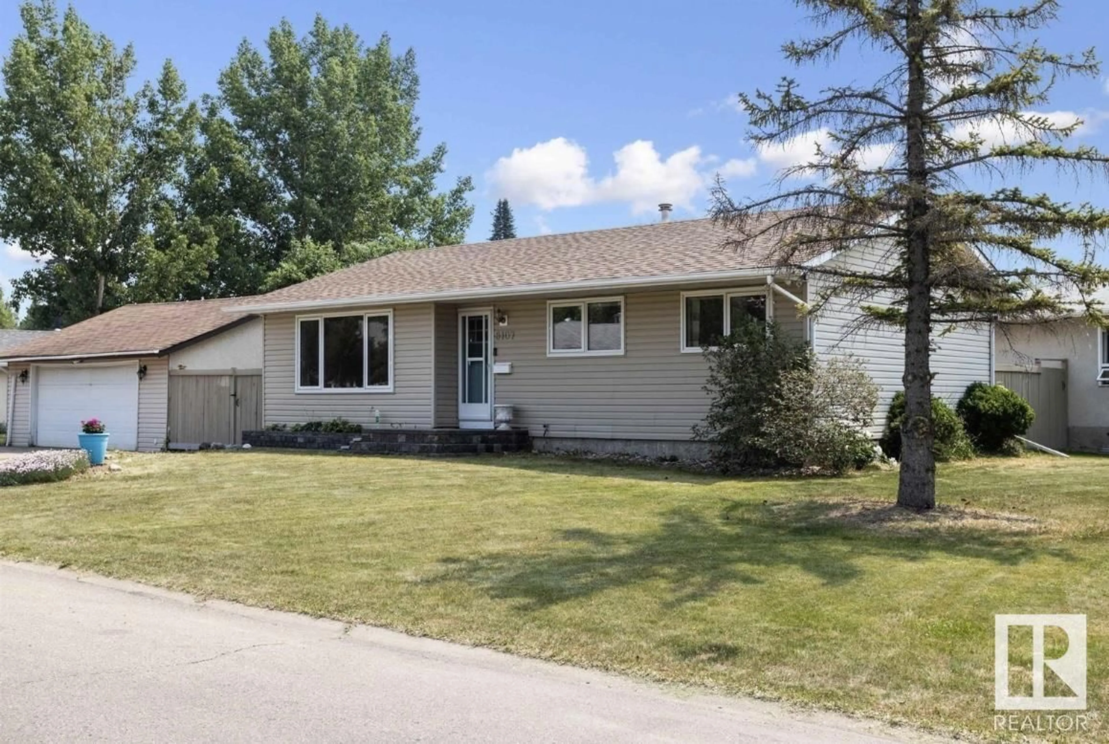 Home with vinyl exterior material, street for 8107 22 AV, Edmonton Alberta T6X1Z2
