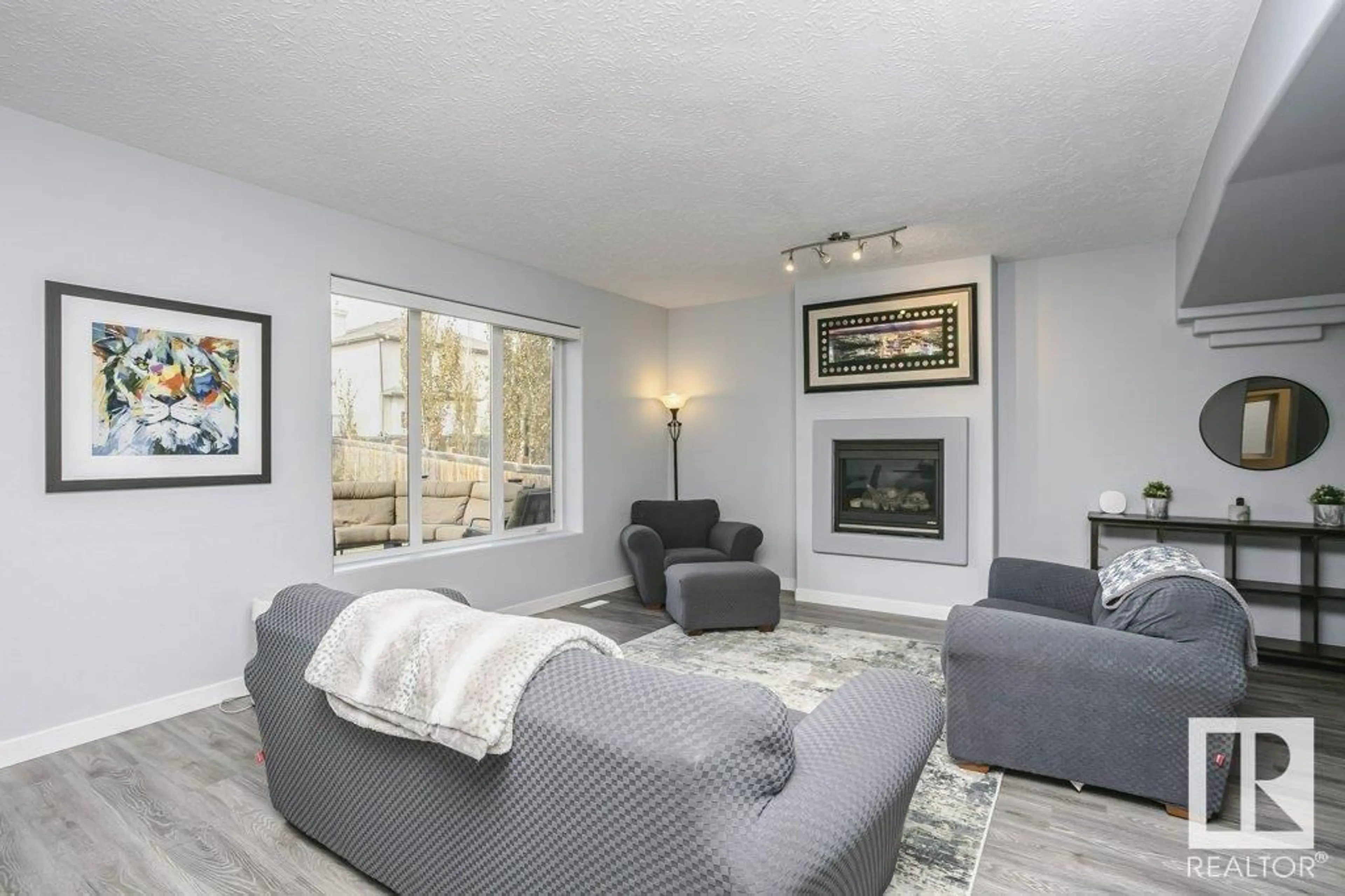 Living room with furniture, unknown for NW - 4713 161 AV, Edmonton Alberta T5Y0H2