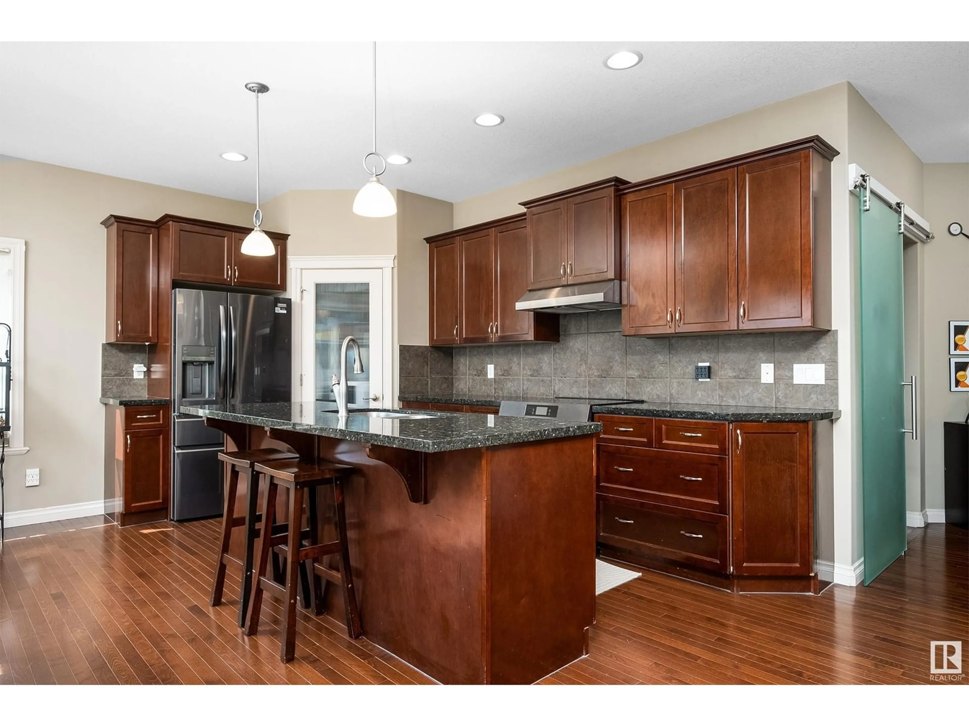 Open concept kitchen, wood/laminate floor for 21 VICTOR CT, Spruce Grove Alberta T7X0H2