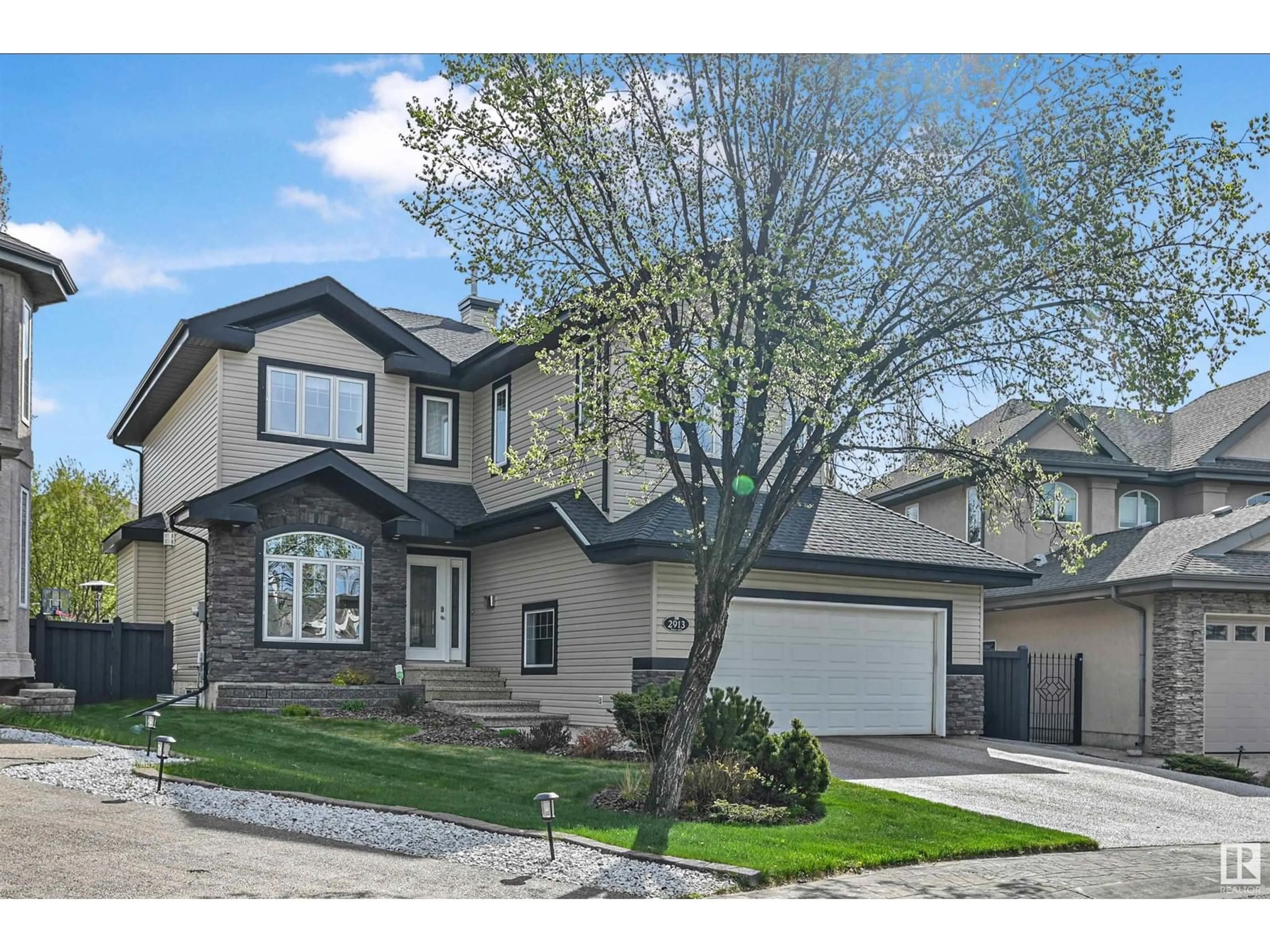 Home with vinyl exterior material, street for 2913 TREDGER GR, Edmonton Alberta T6R3R7