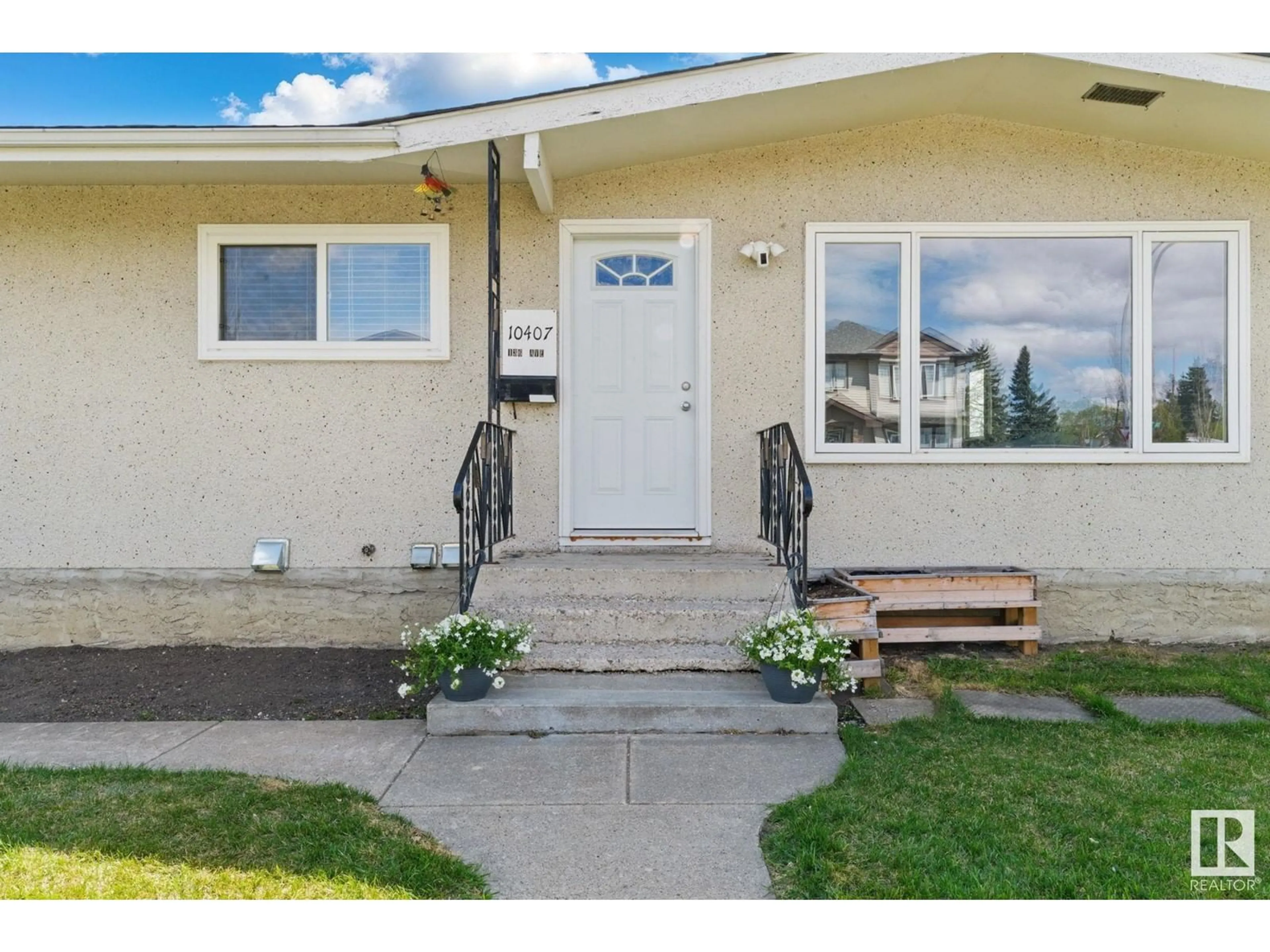 Home with vinyl exterior material, street for NW - 10407 136 AVE, Edmonton Alberta T5E1W2