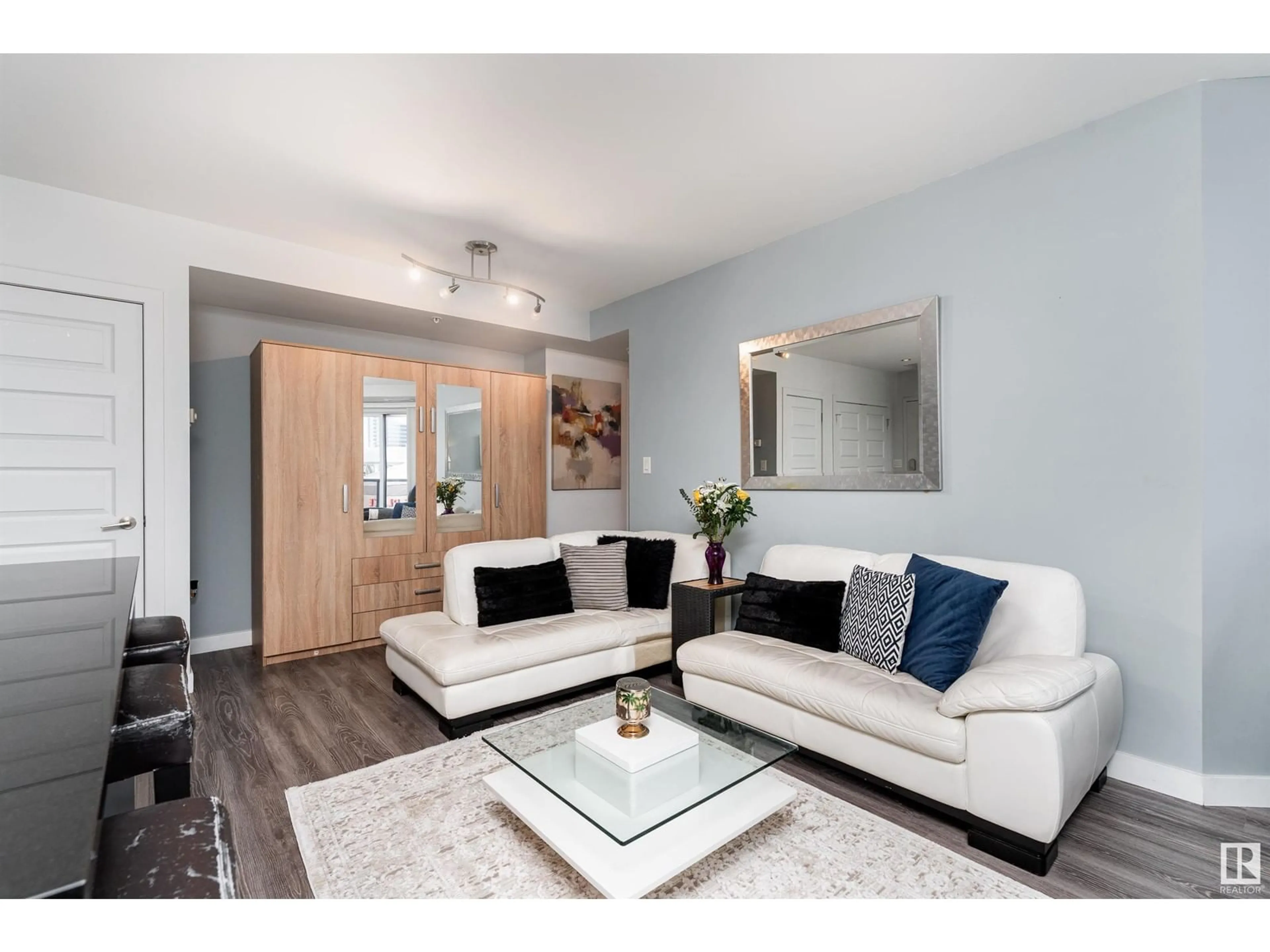 Living room with furniture, wood/laminate floor for 10388 - 1106 105 ST NW, Edmonton Alberta T5J0C2