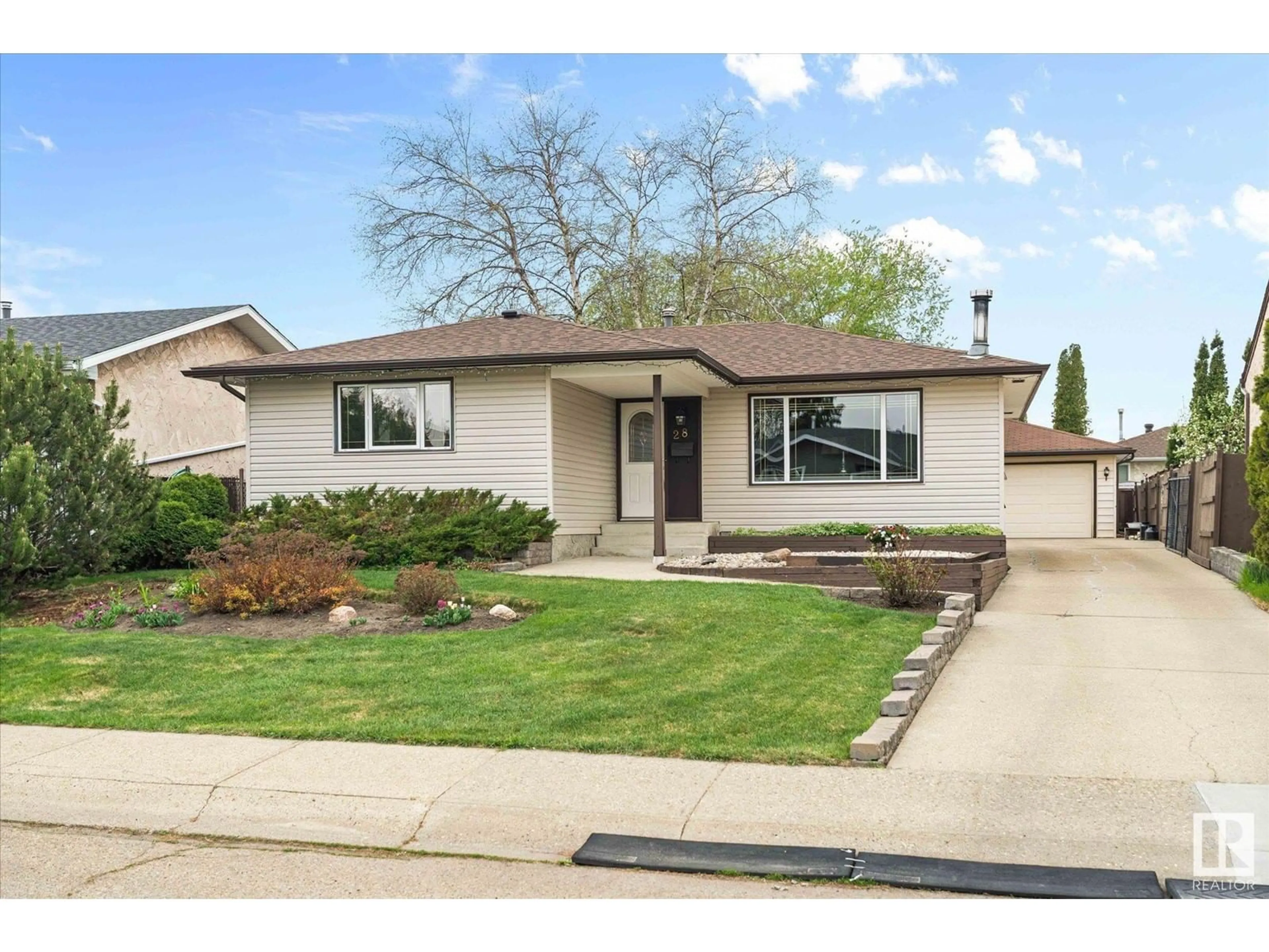 Home with vinyl exterior material, street for 28 HUGHES RD, Edmonton Alberta T5A4E2