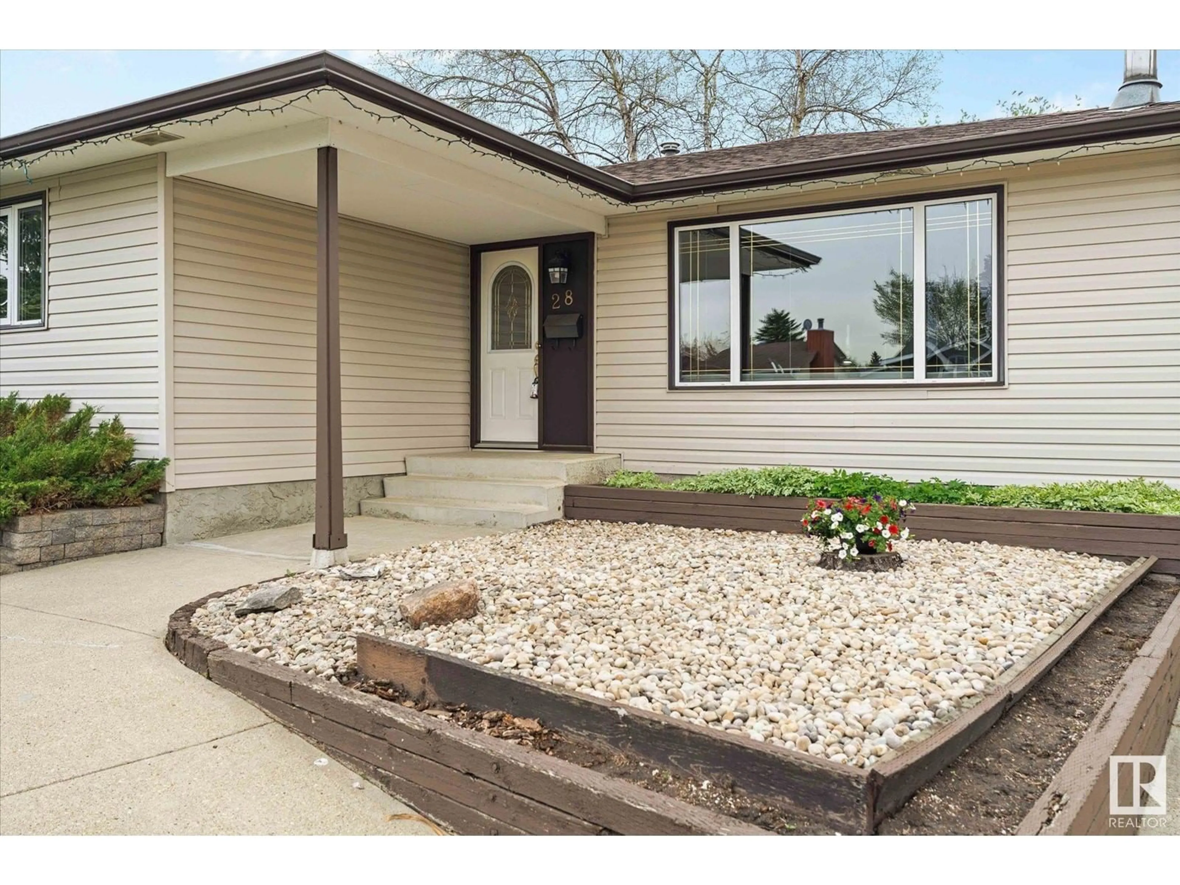 Home with vinyl exterior material, street for 28 HUGHES RD, Edmonton Alberta T5A4E2