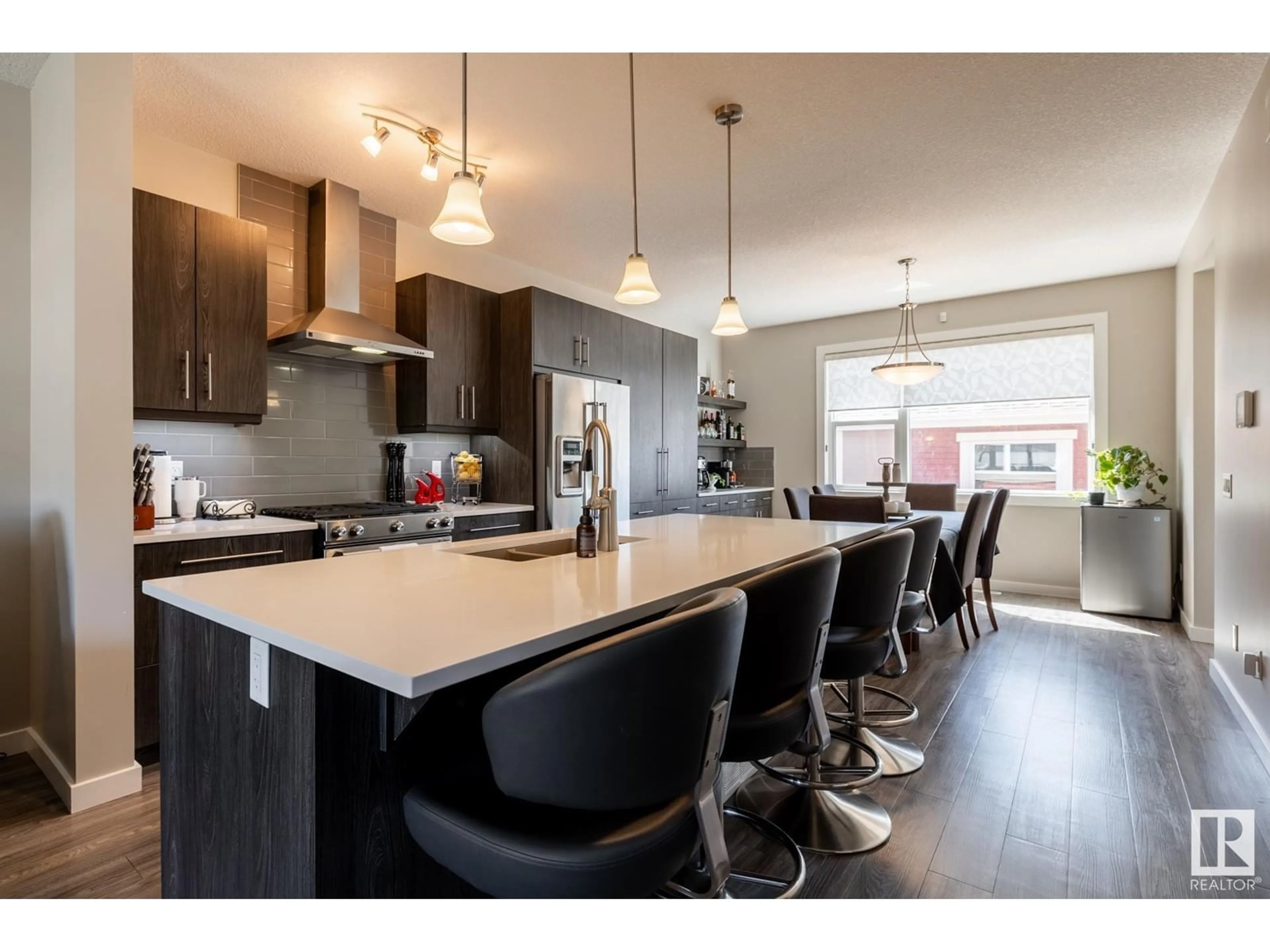 Open concept kitchen, wood/laminate floor for 7403 COLONEL MEWBURN RD, Edmonton Alberta T5E6V7