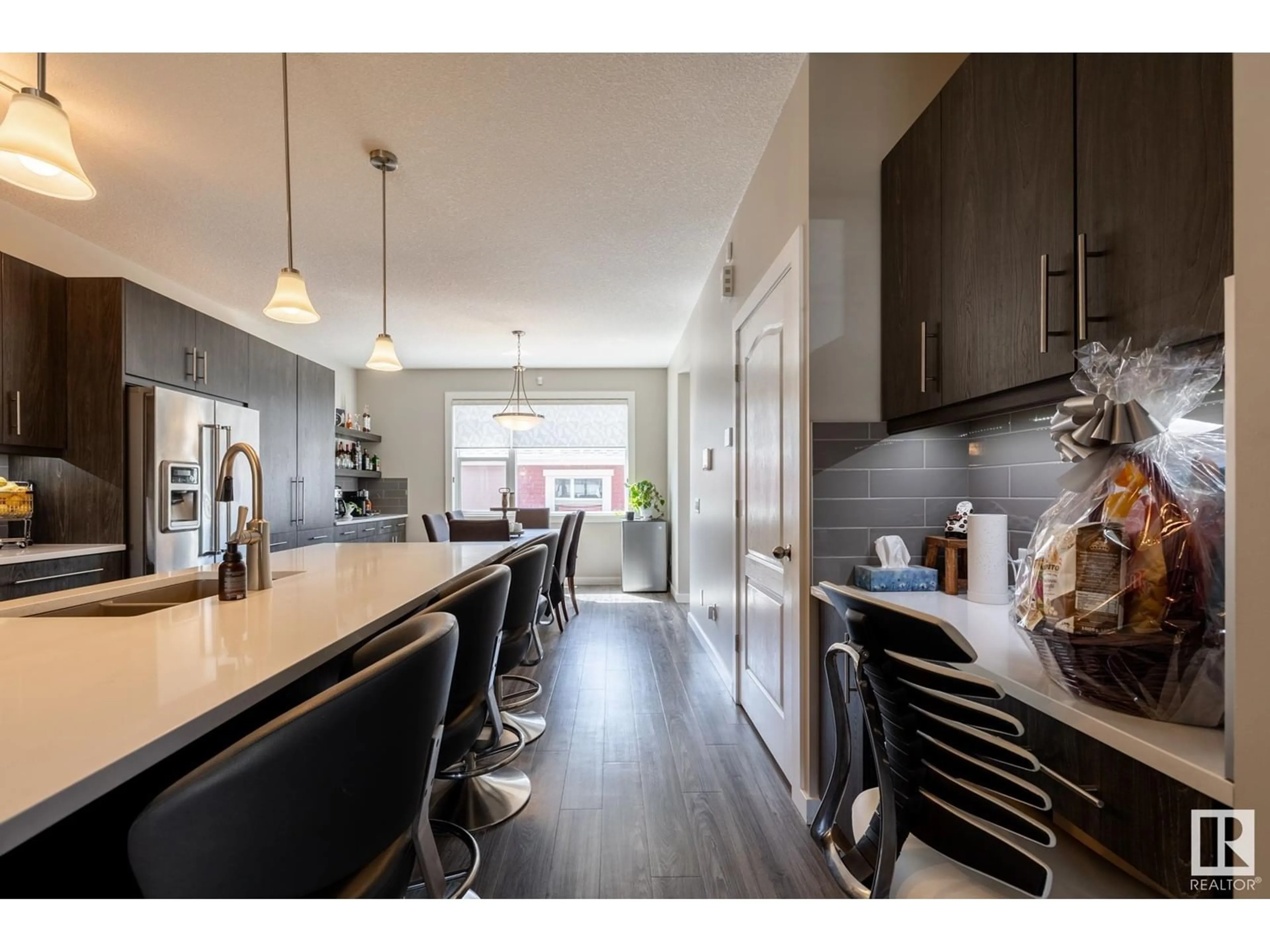 Open concept kitchen, wood/laminate floor for 7403 COLONEL MEWBURN RD, Edmonton Alberta T5E6V7