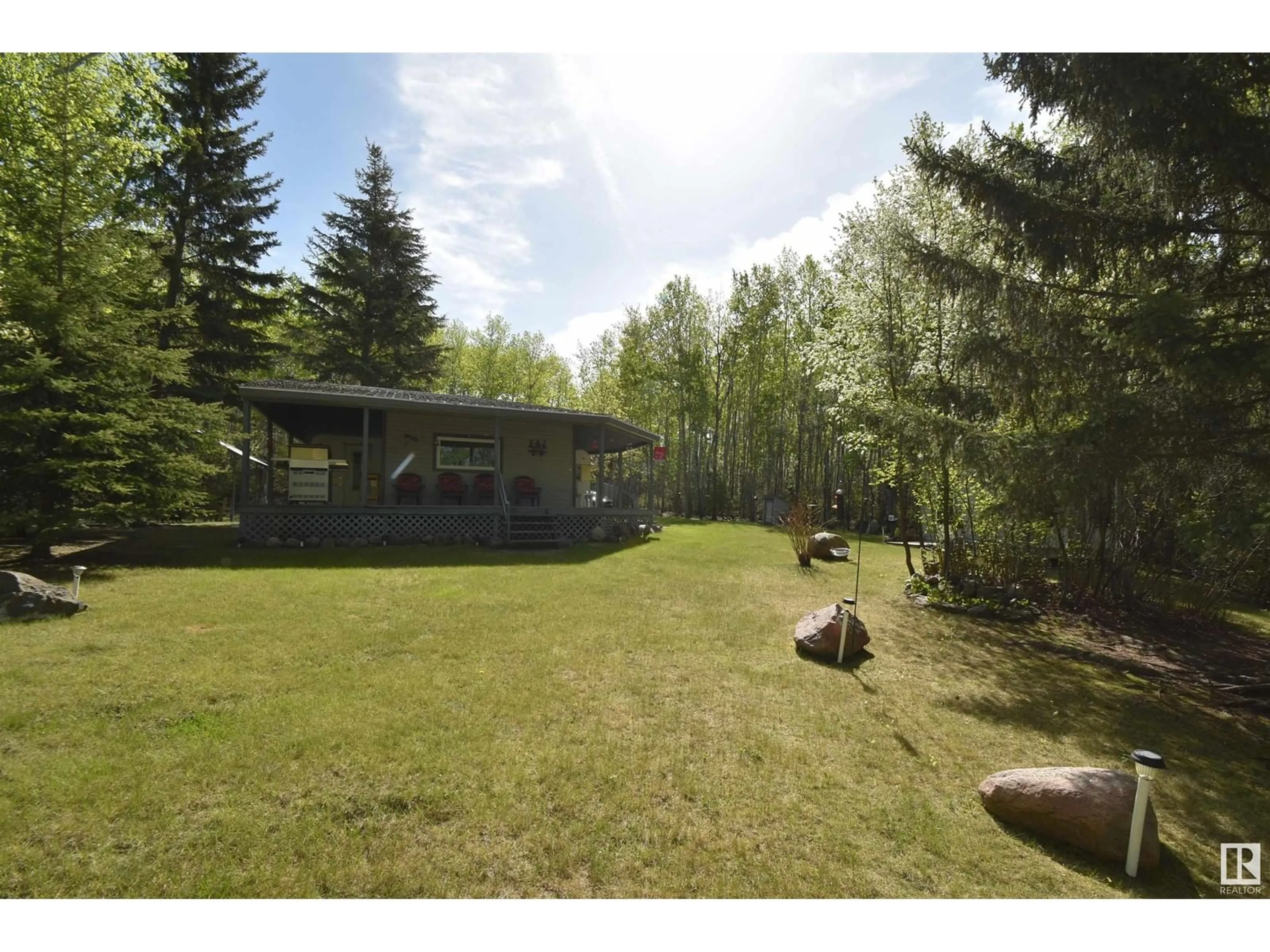 A pic from outside/outdoor area/front of a property/back of a property/a pic from drone, forest/trees view for 113 - 228 RNG RD, Rural St. Paul County Alberta T0A2Y0