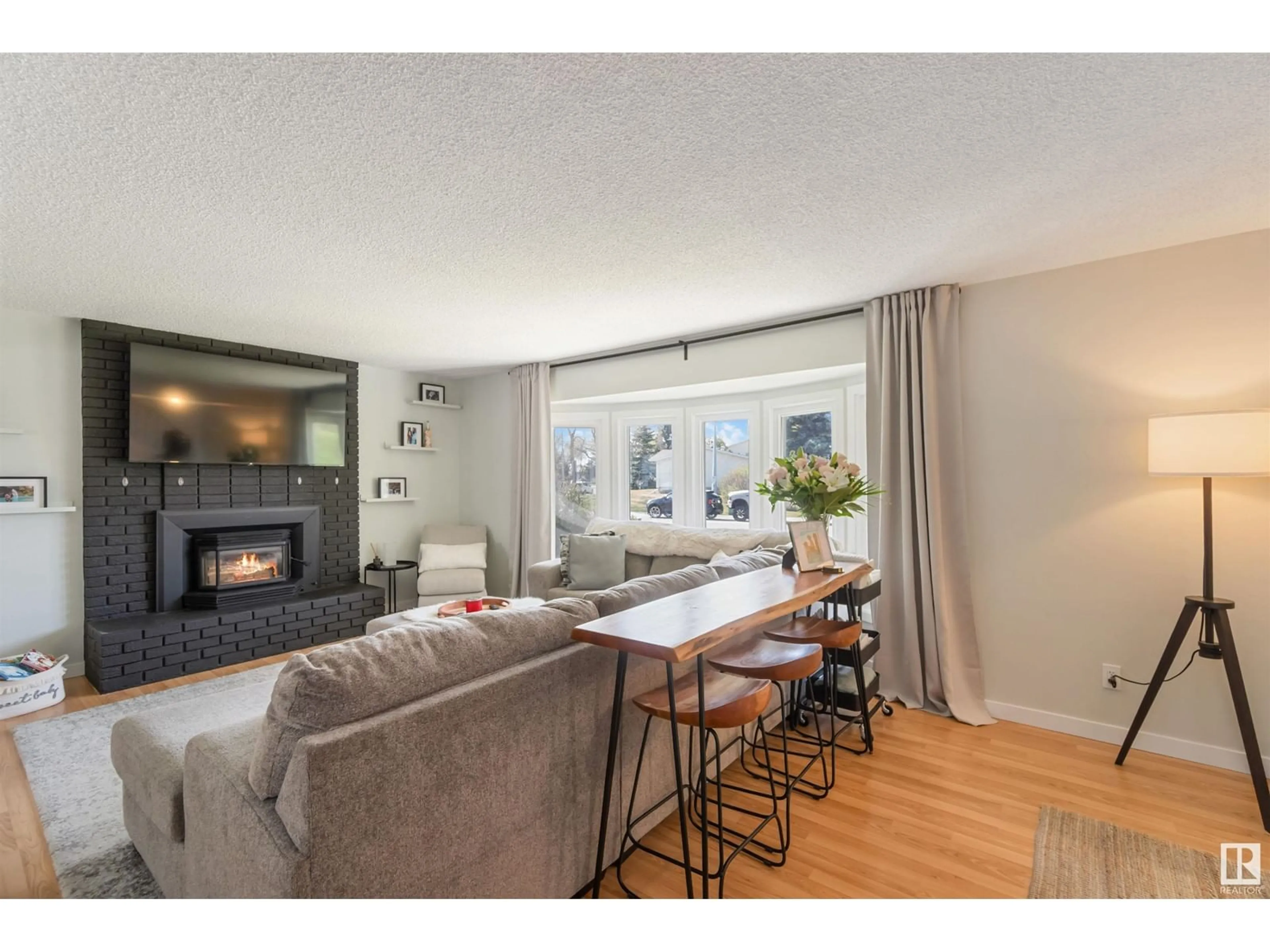Living room with furniture, wood/laminate floor for 50 BELLA COOLA DR, Leduc Alberta T9E4J2
