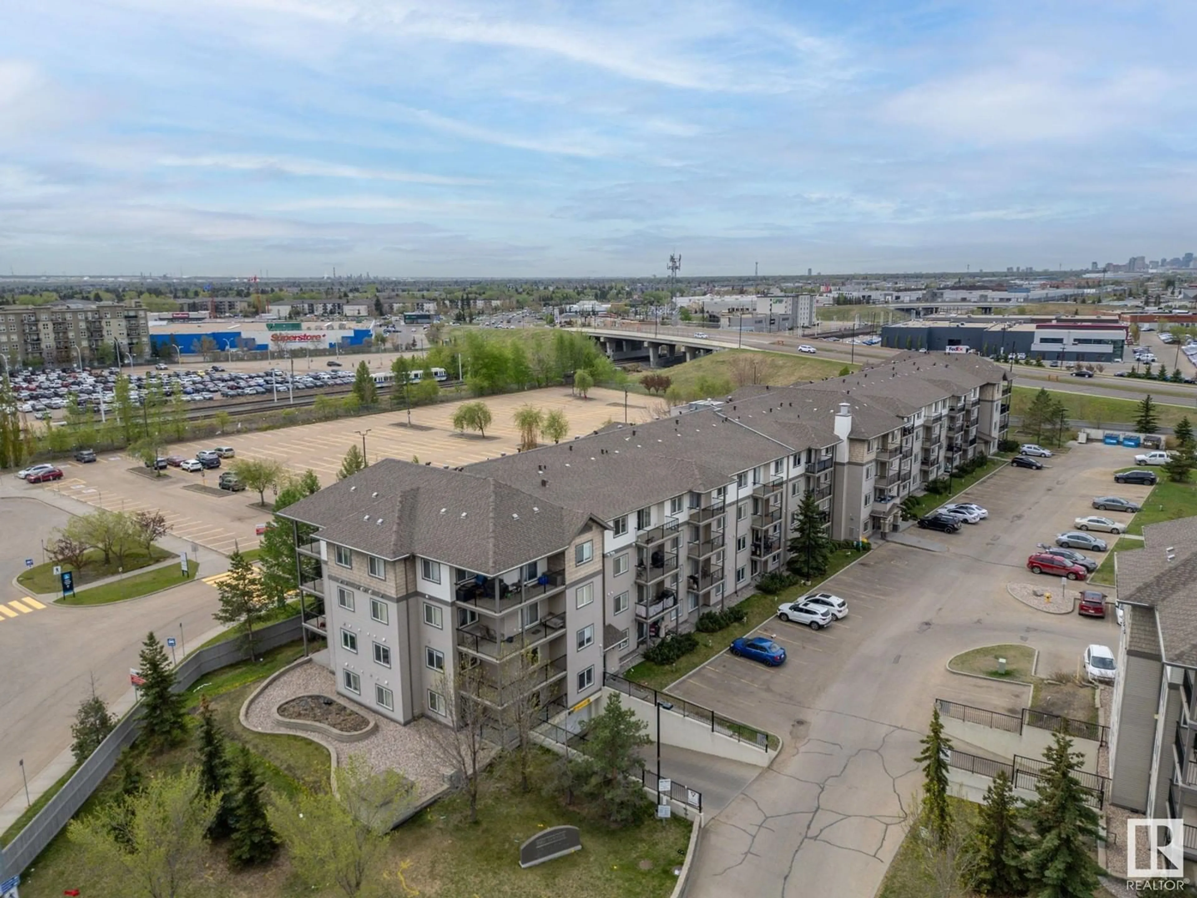A pic from outside/outdoor area/front of a property/back of a property/a pic from drone, unknown for #407 - 309 CLAREVIEW STATION DR, Edmonton Alberta T5Y0C5