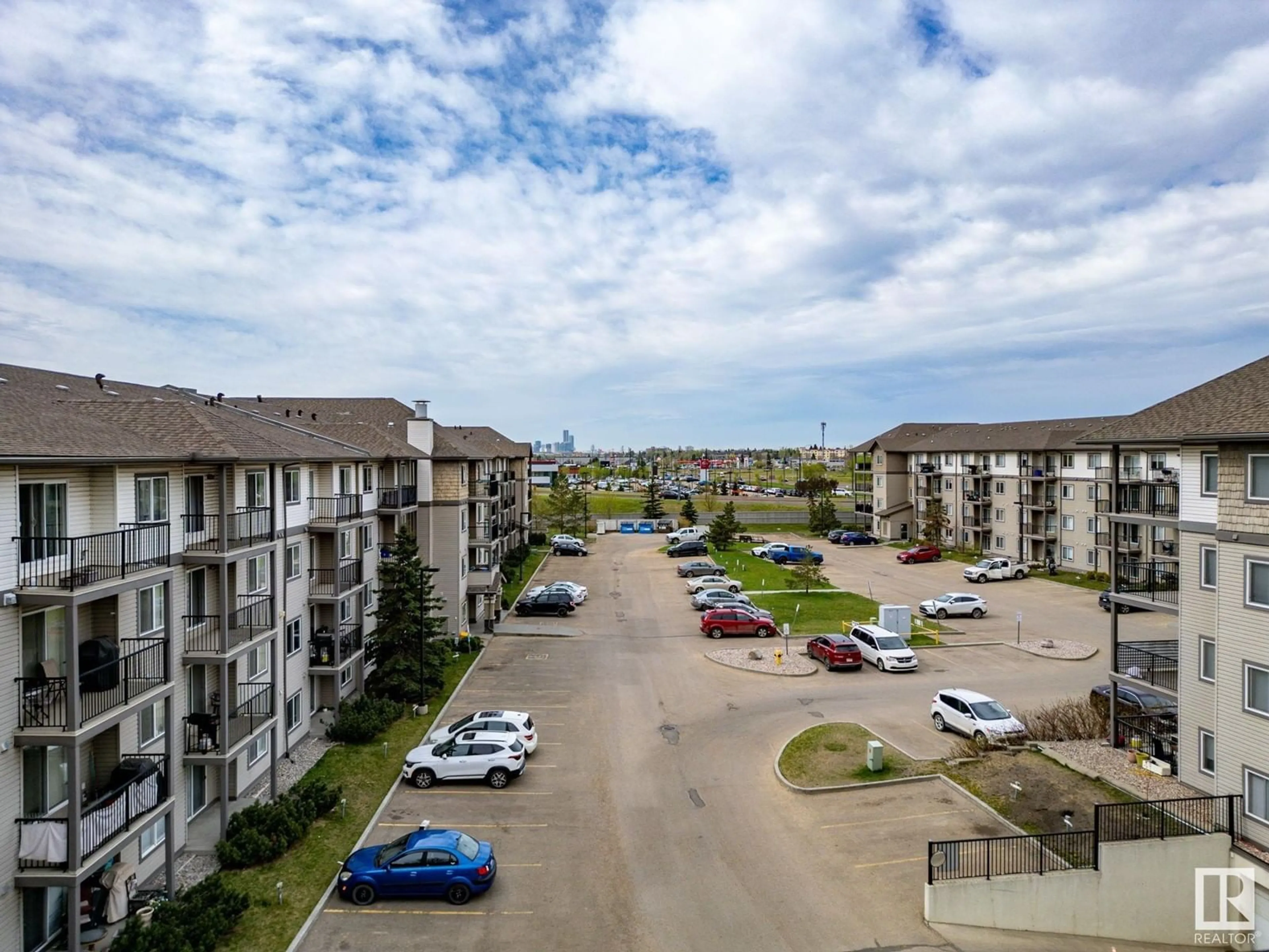 A pic from outside/outdoor area/front of a property/back of a property/a pic from drone, unknown for #407 - 309 CLAREVIEW STATION DR, Edmonton Alberta T5Y0C5
