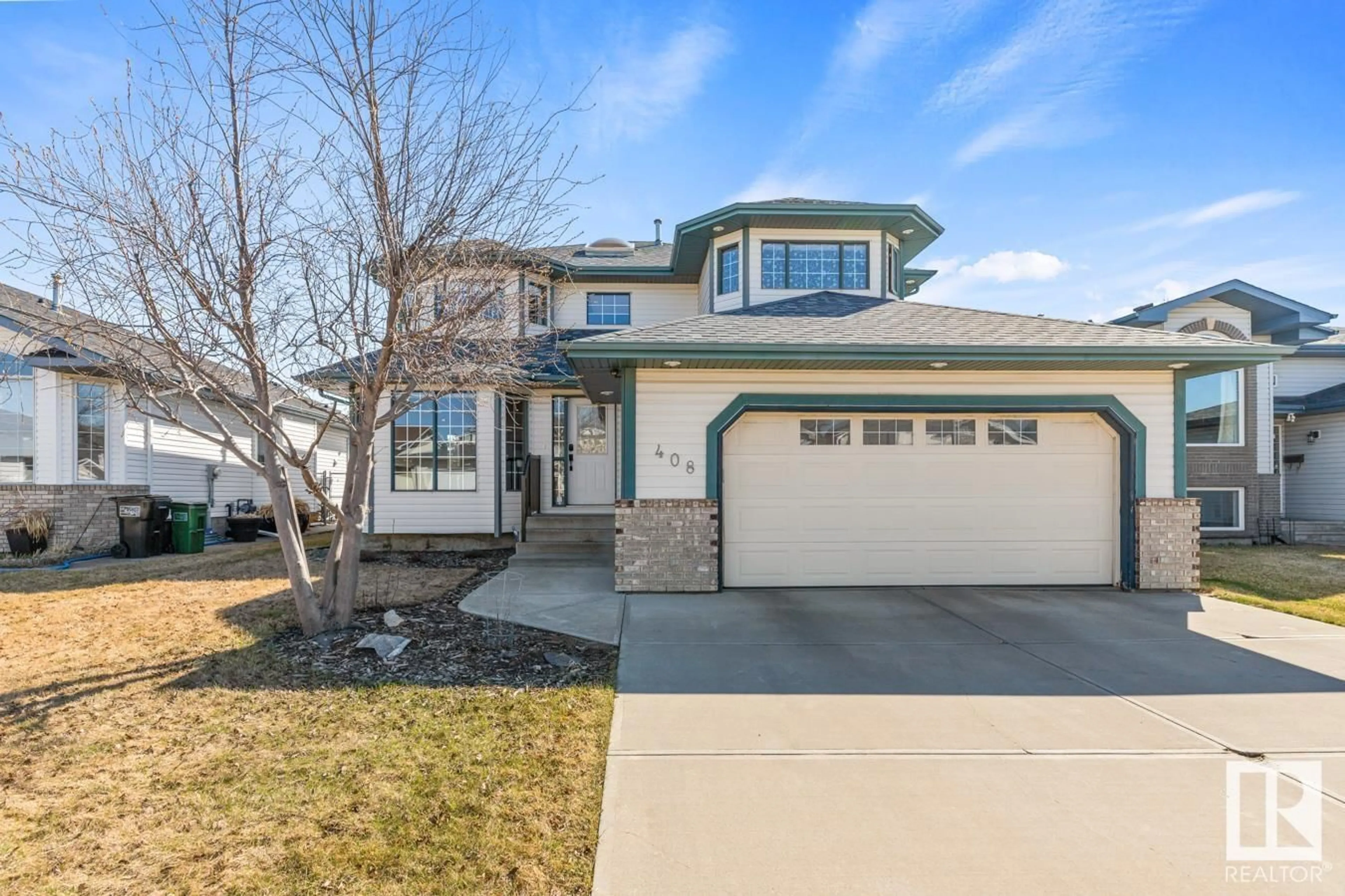 Home with vinyl exterior material, street for 408 HOLLICK-KENYON RD, Edmonton Alberta T5Y2T9