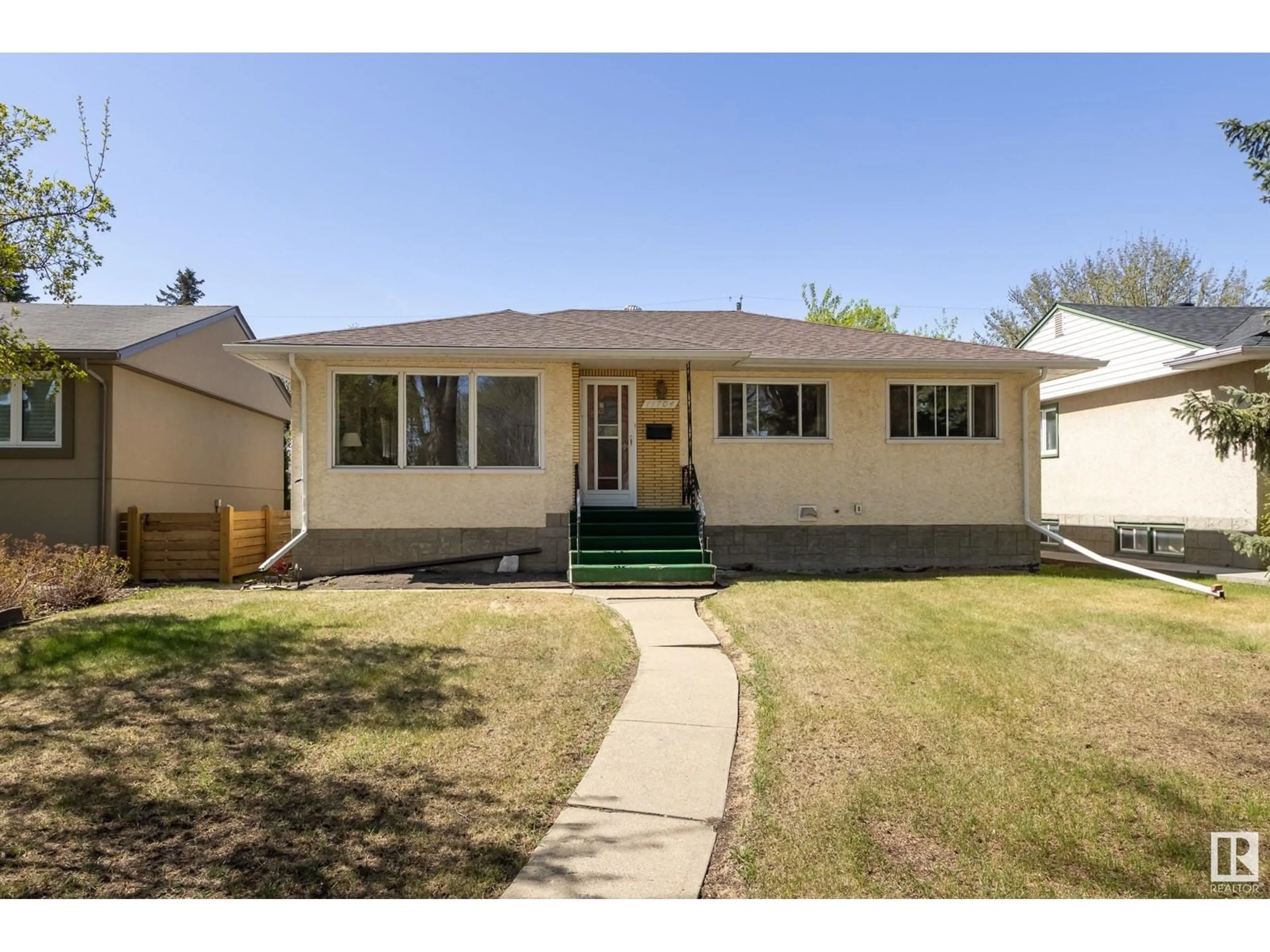 Home with vinyl exterior material, street for NW - 11704 136 ST, Edmonton Alberta T5M1M8
