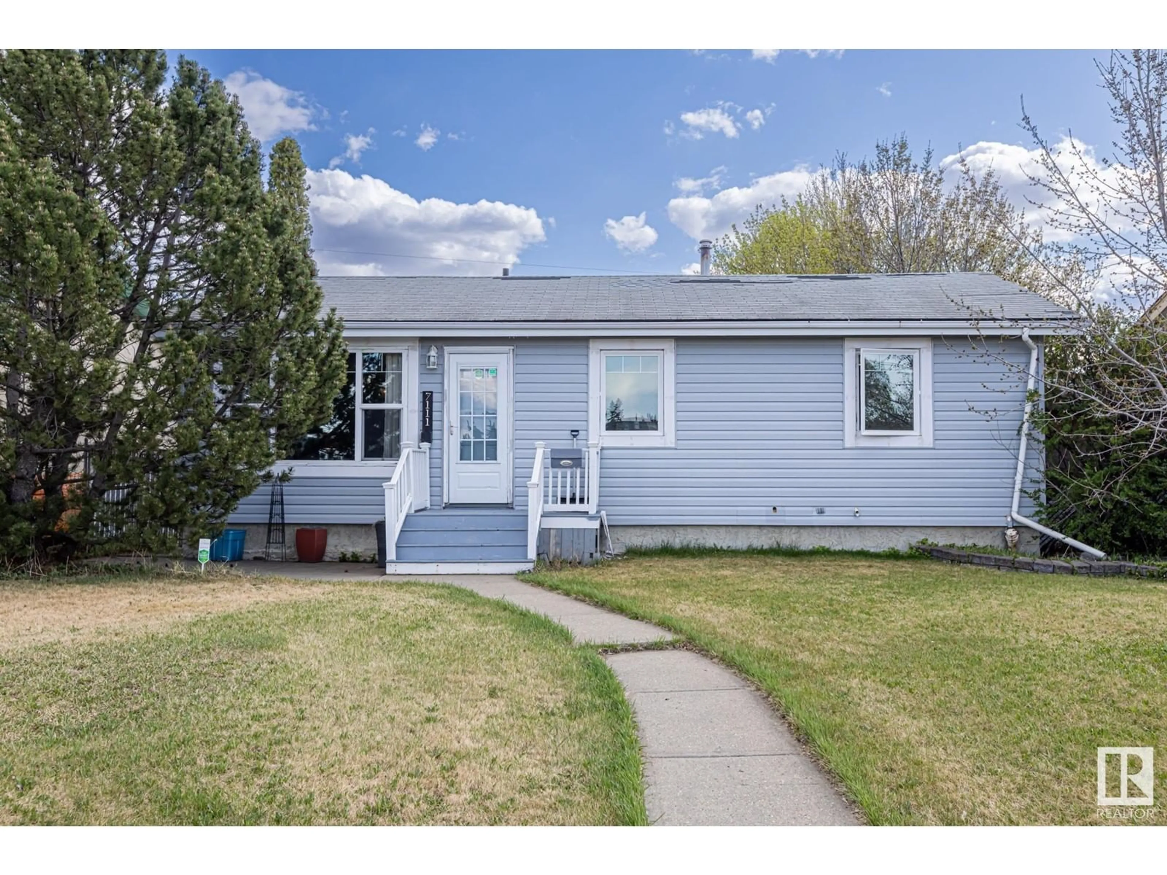 Home with vinyl exterior material, street for 7111 130A AV, Edmonton Alberta T5C1Y8