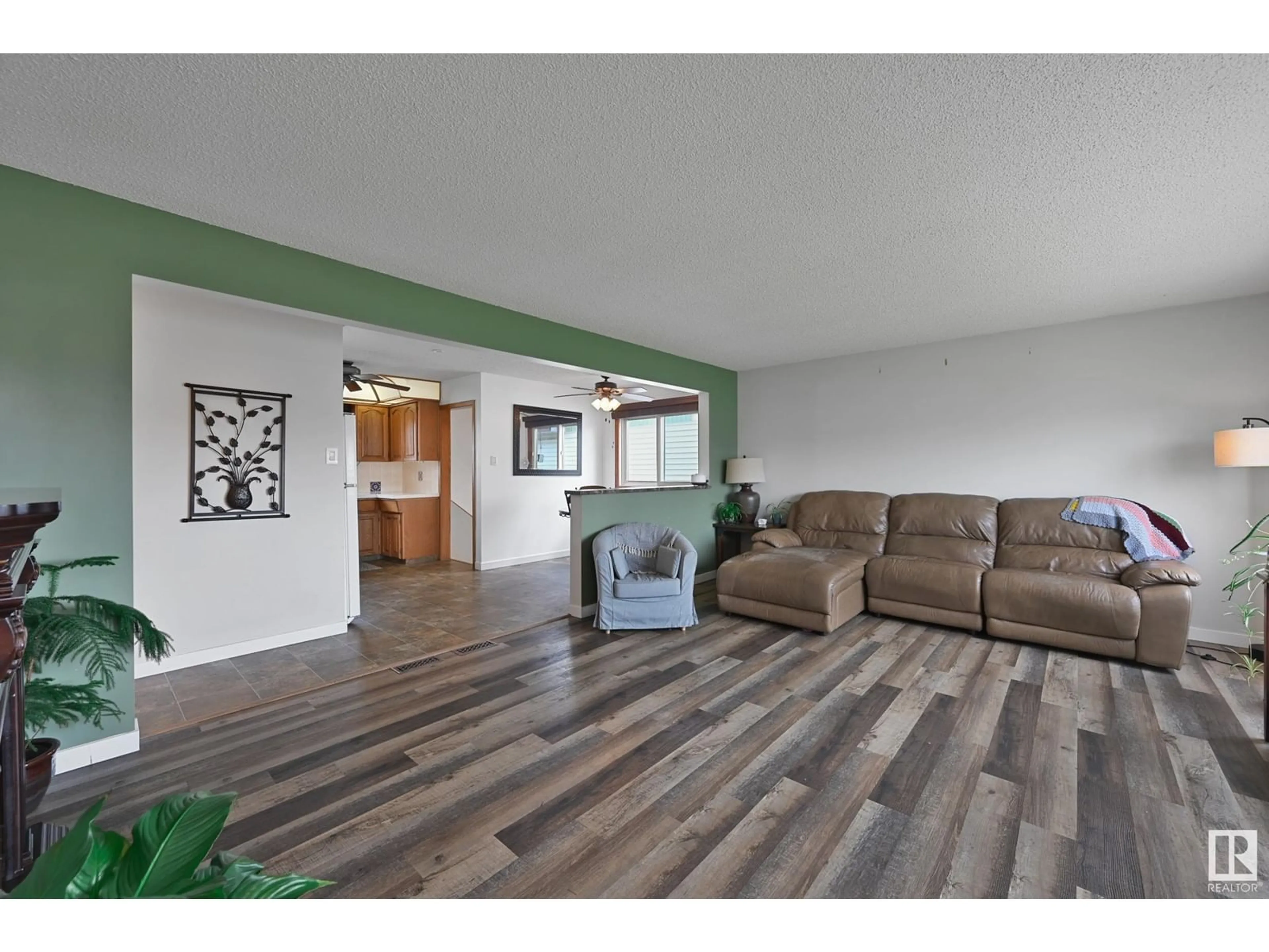 Living room with furniture, wood/laminate floor for 7820 130 AV, Edmonton Alberta T5C1V5