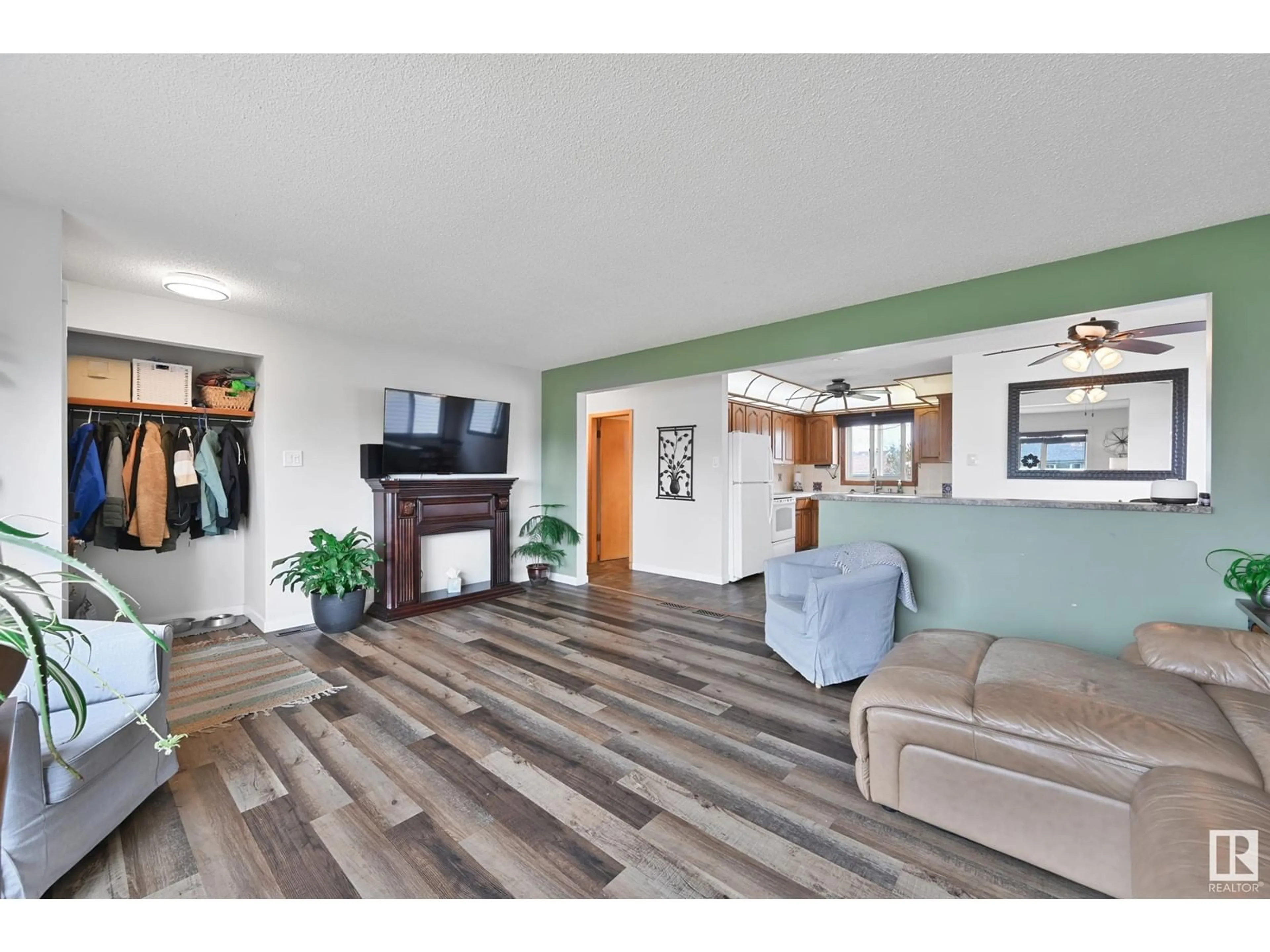 Living room with furniture, wood/laminate floor for 7820 130 AV, Edmonton Alberta T5C1V5
