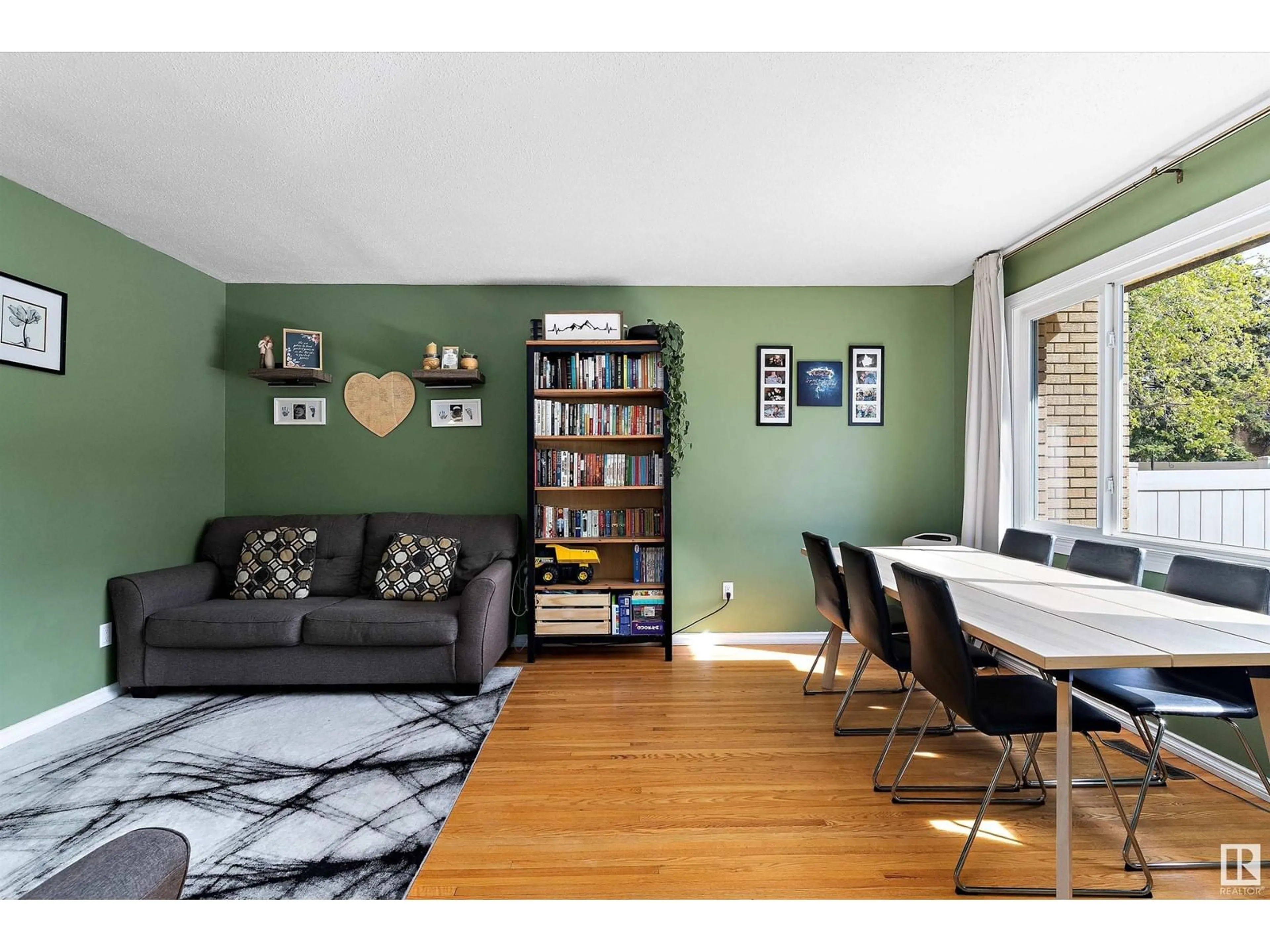 Living room with furniture, wood/laminate floor for 127 LONDONDERRY SQUARE, Edmonton Alberta T5C3C4