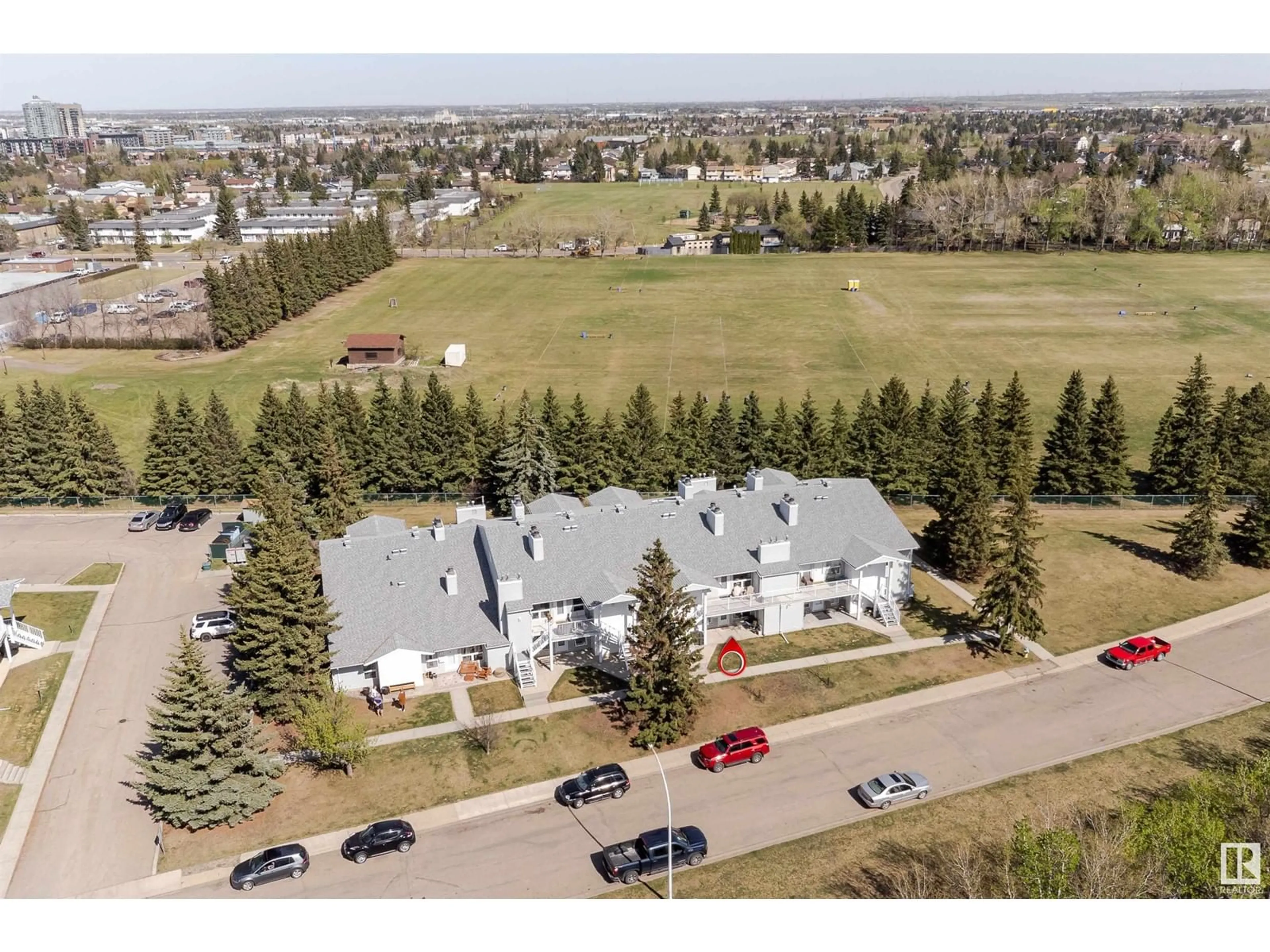 A pic from outside/outdoor area/front of a property/back of a property/a pic from drone, unknown for #4 - 2115 118 ST, Edmonton Alberta T6J5N1