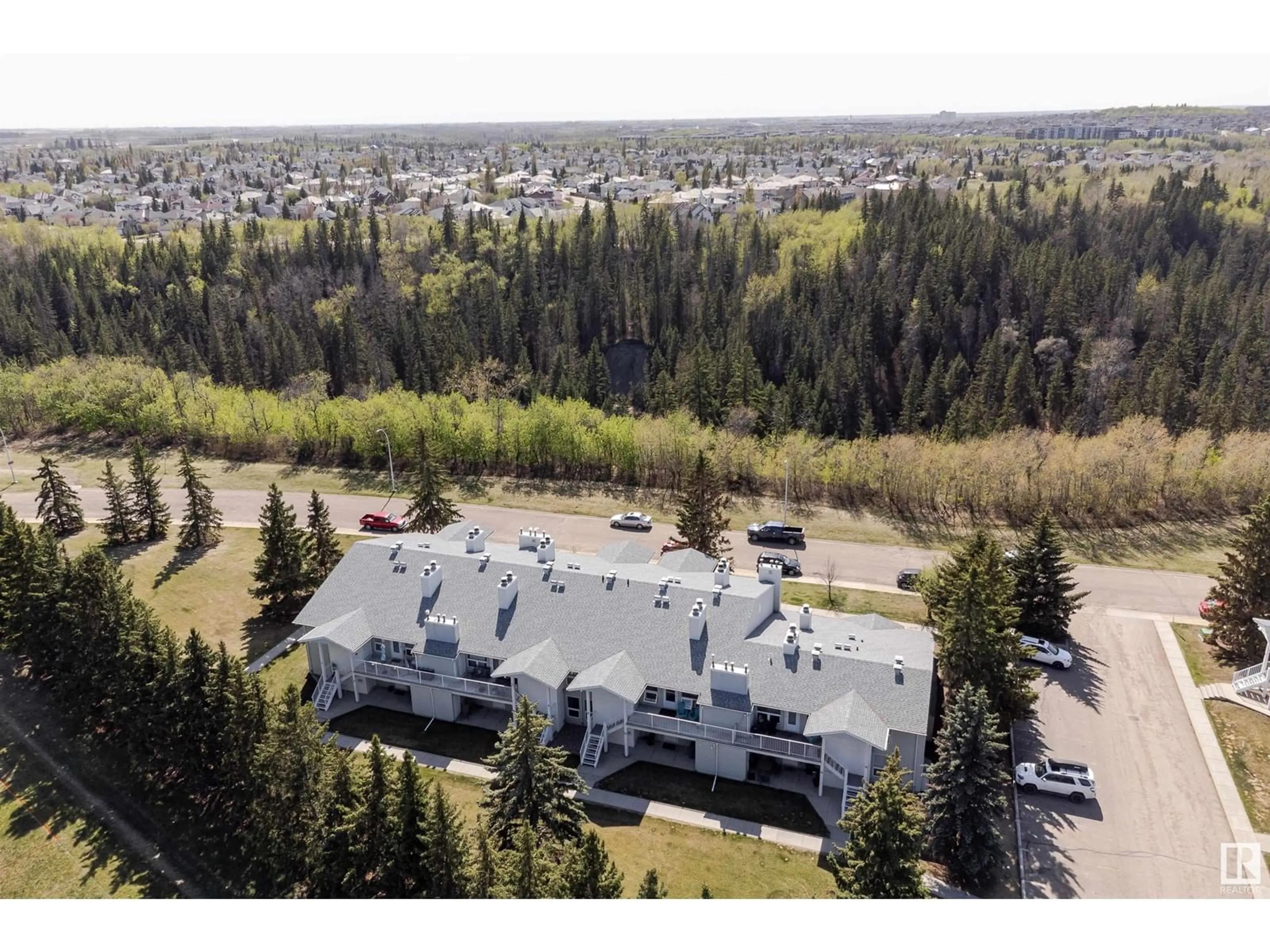 A pic from outside/outdoor area/front of a property/back of a property/a pic from drone, mountain view for #4 - 2115 118 ST, Edmonton Alberta T6J5N1