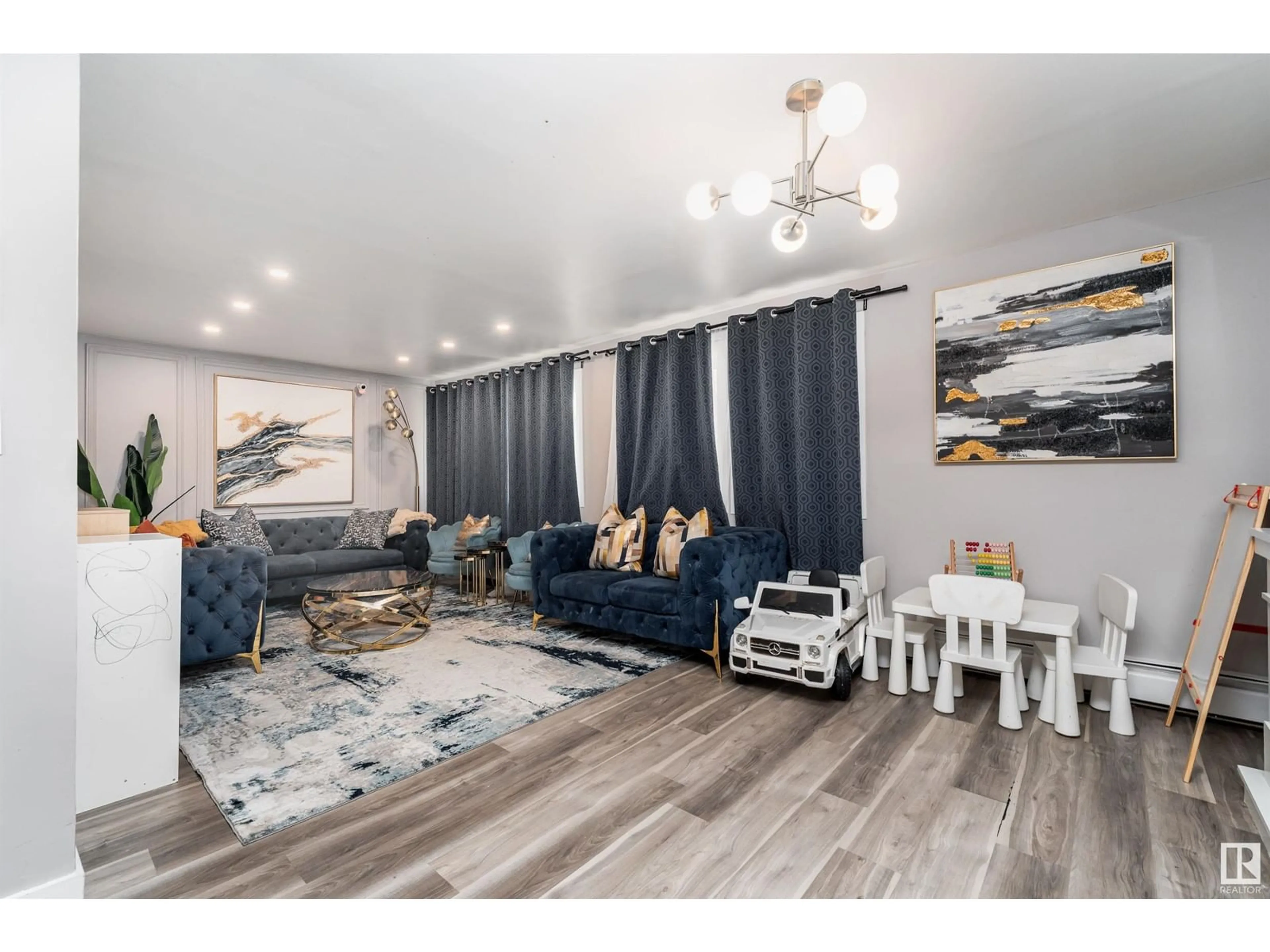 Living room with furniture, wood/laminate floor for B1 - 9325 104 AV, Edmonton Alberta T5H0H9