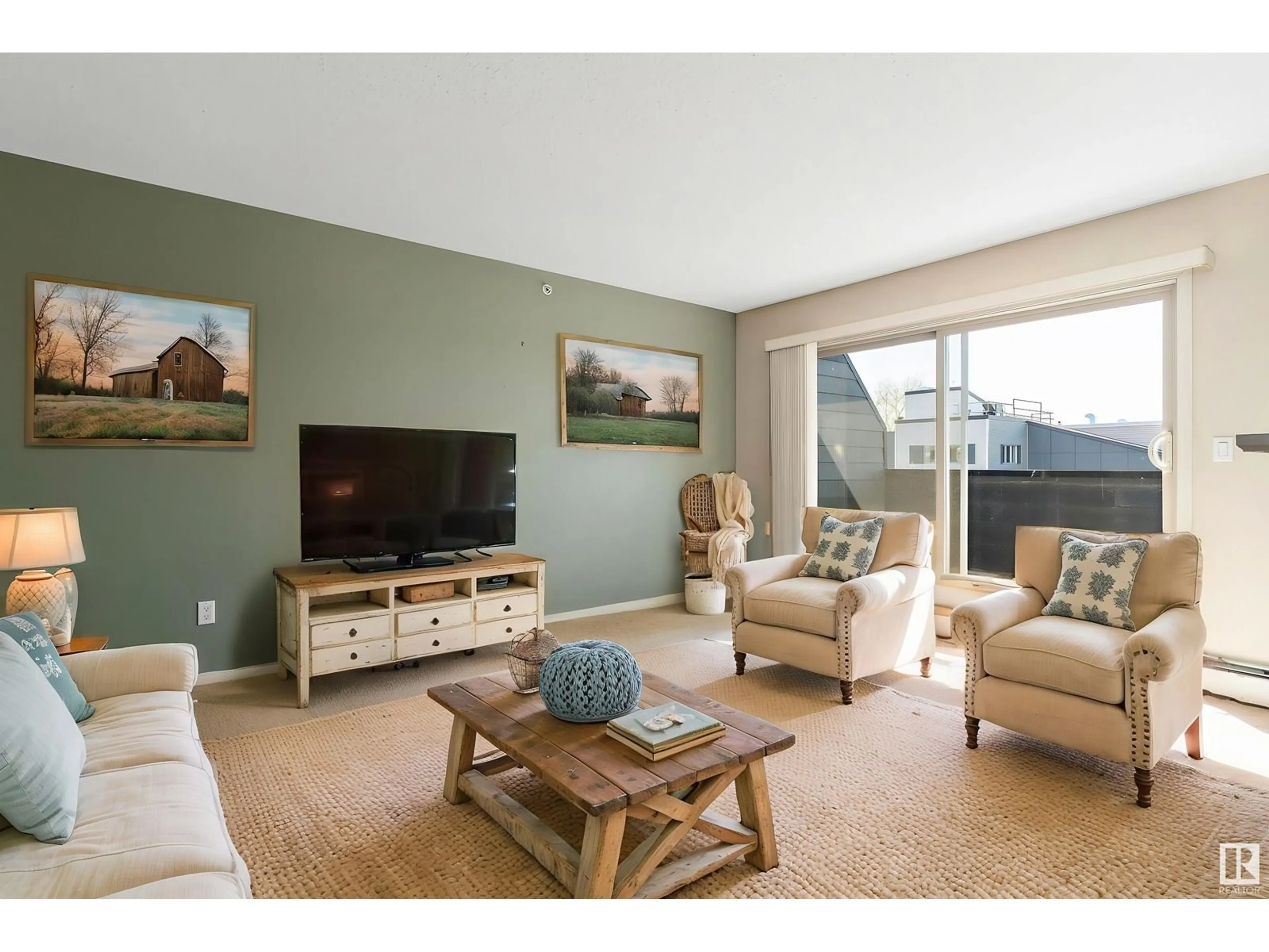 Living room with furniture, wood/laminate floor for #412 - 17011 67 AV, Edmonton Alberta T5T6Y6