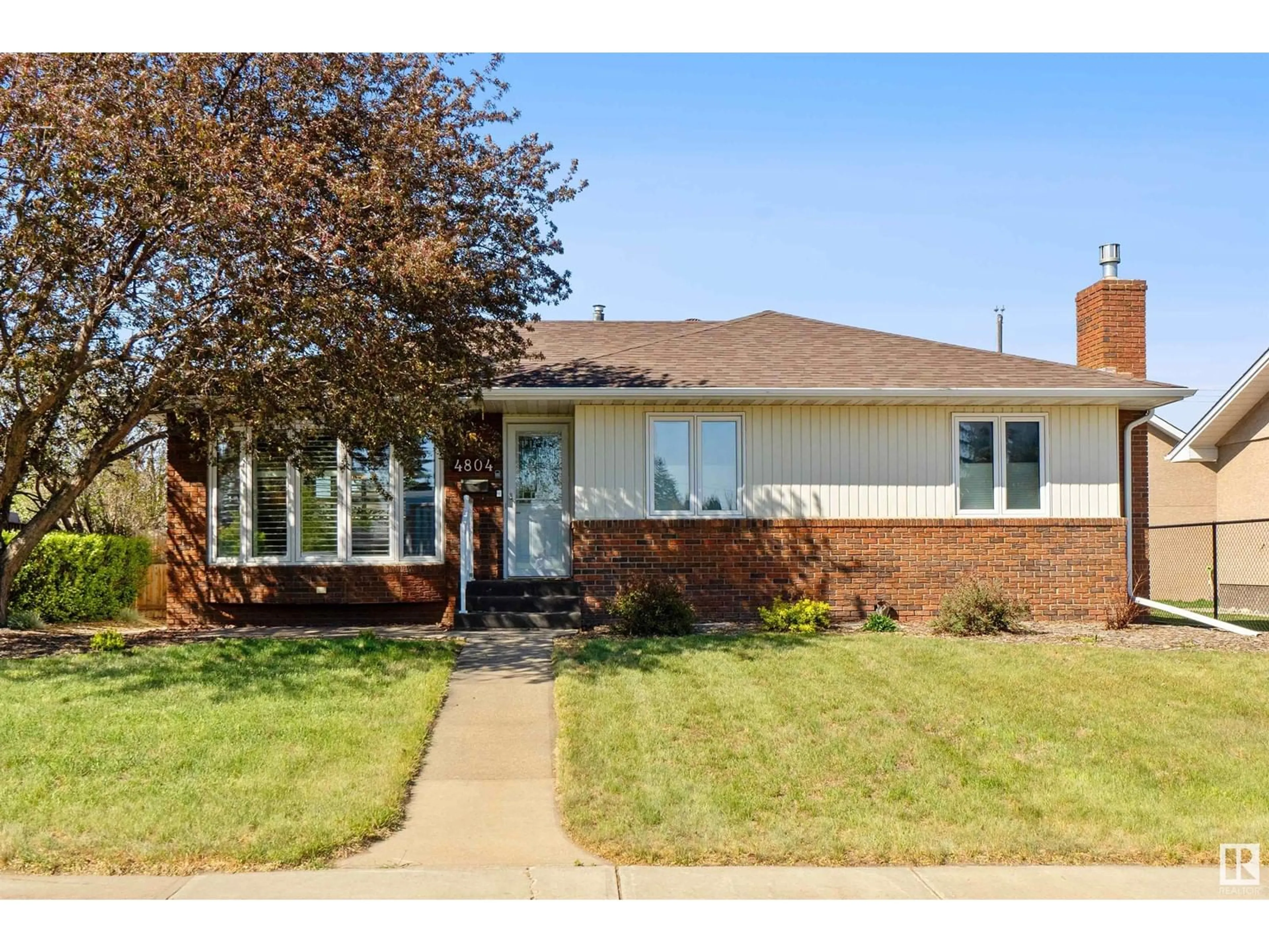 Home with brick exterior material, street for 4804 106 AV, Edmonton Alberta T6A1E6
