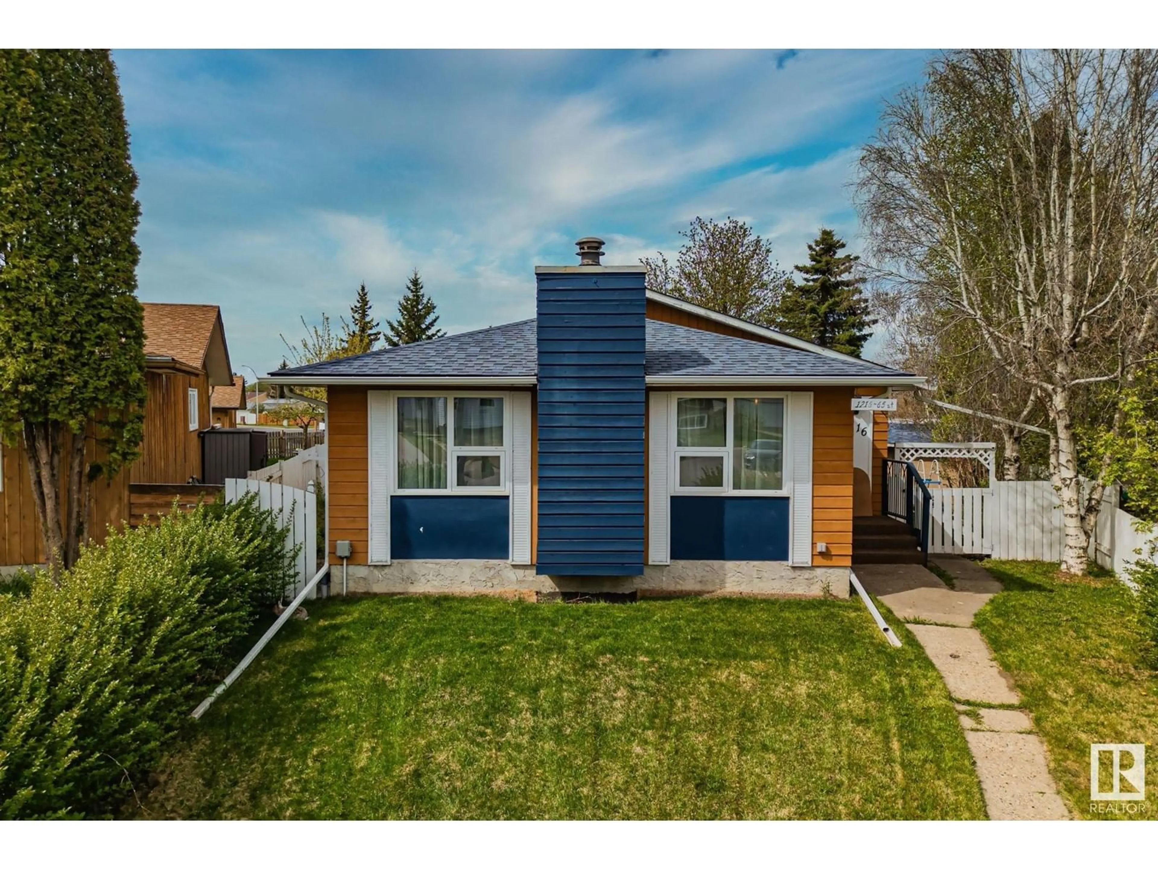 Home with vinyl exterior material, street for NW - 1216 65 ST, Edmonton Alberta T6L2E7