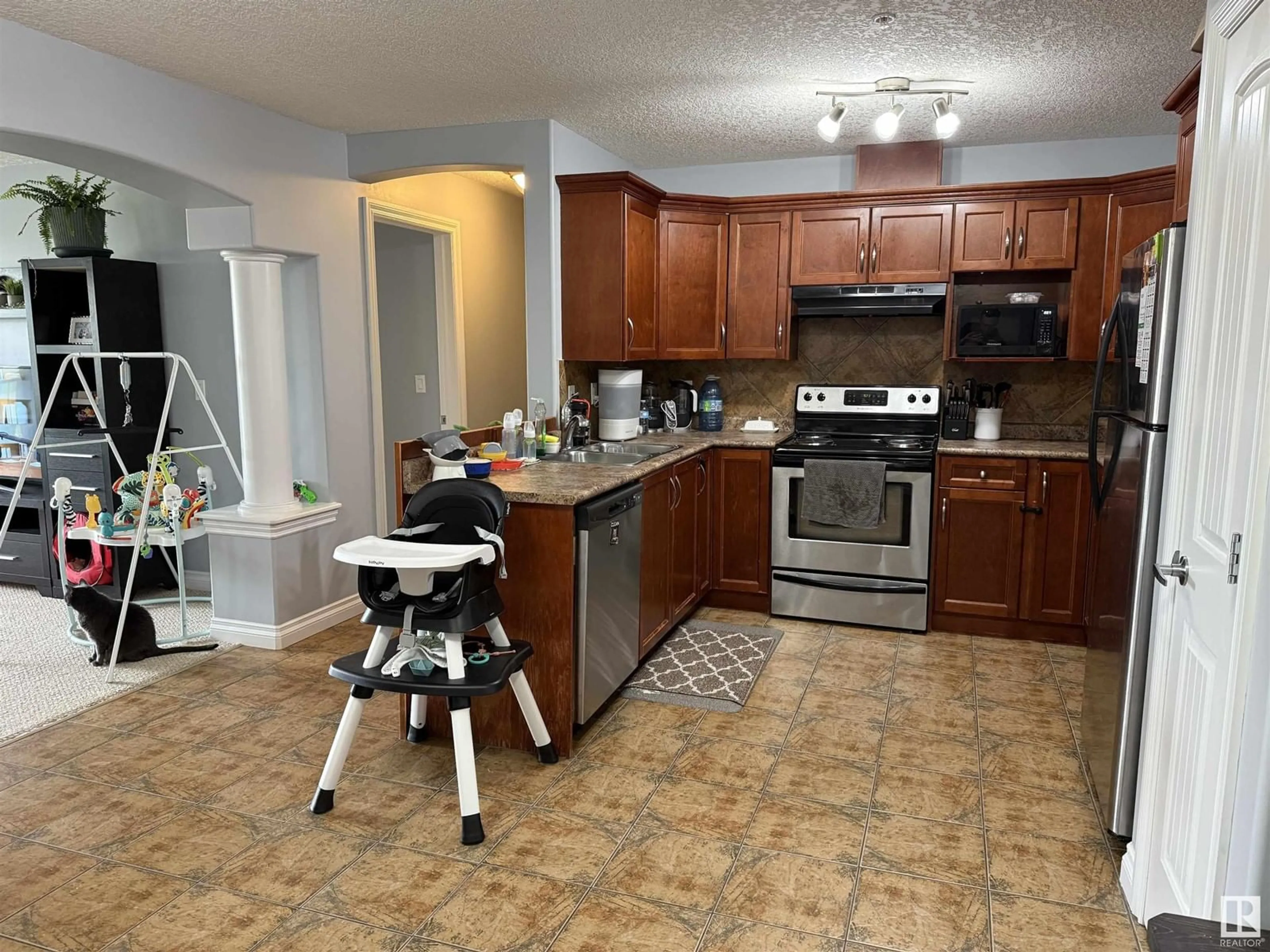 Open concept kitchen, ceramic/tile floor for 210 - 5204 52 AV, Tofield Alberta T0B4J0