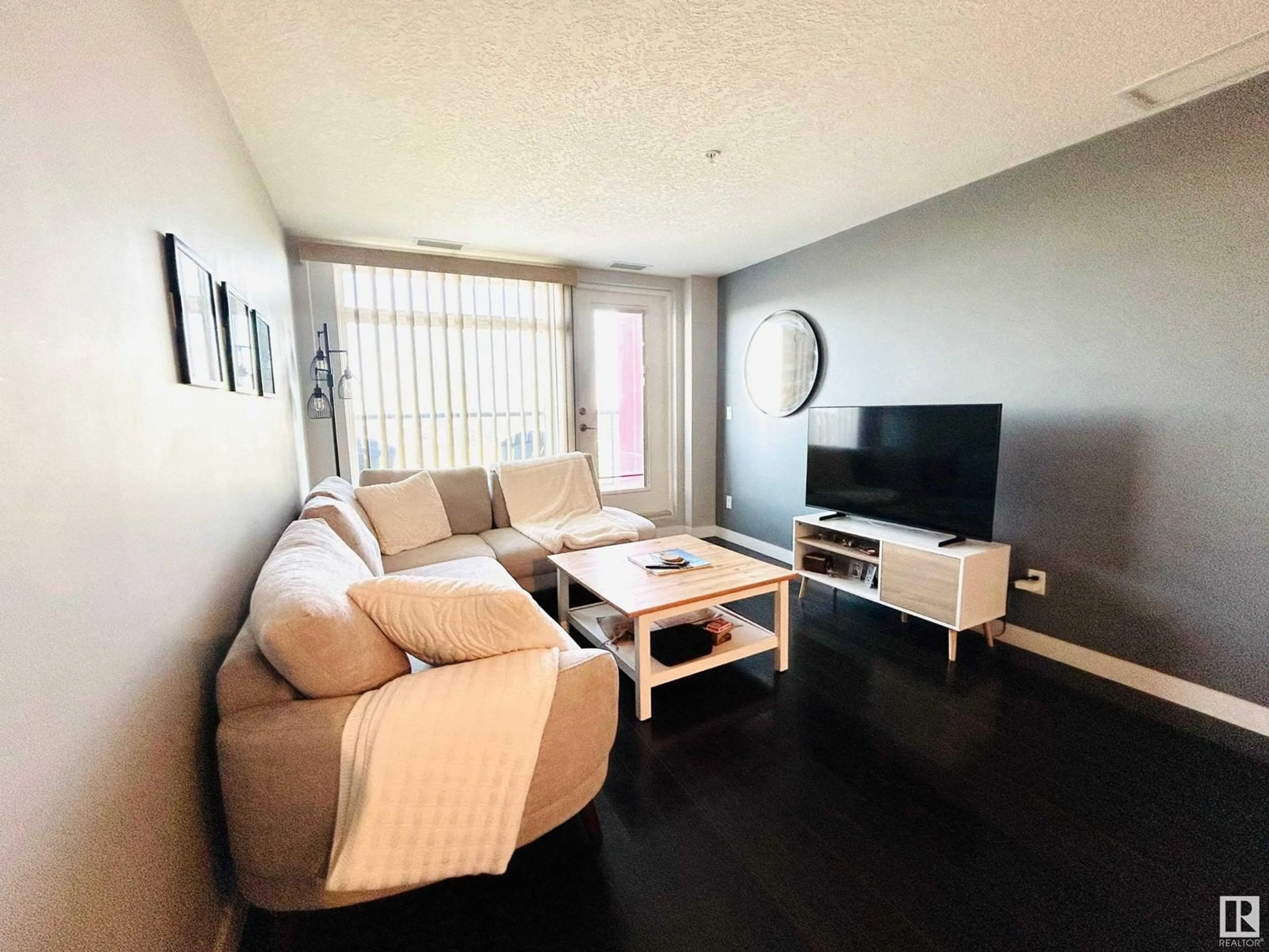 Living room with furniture, wood/laminate floor for 5151 - 925 WINDERMERE BV, Edmonton Alberta T6W2K4