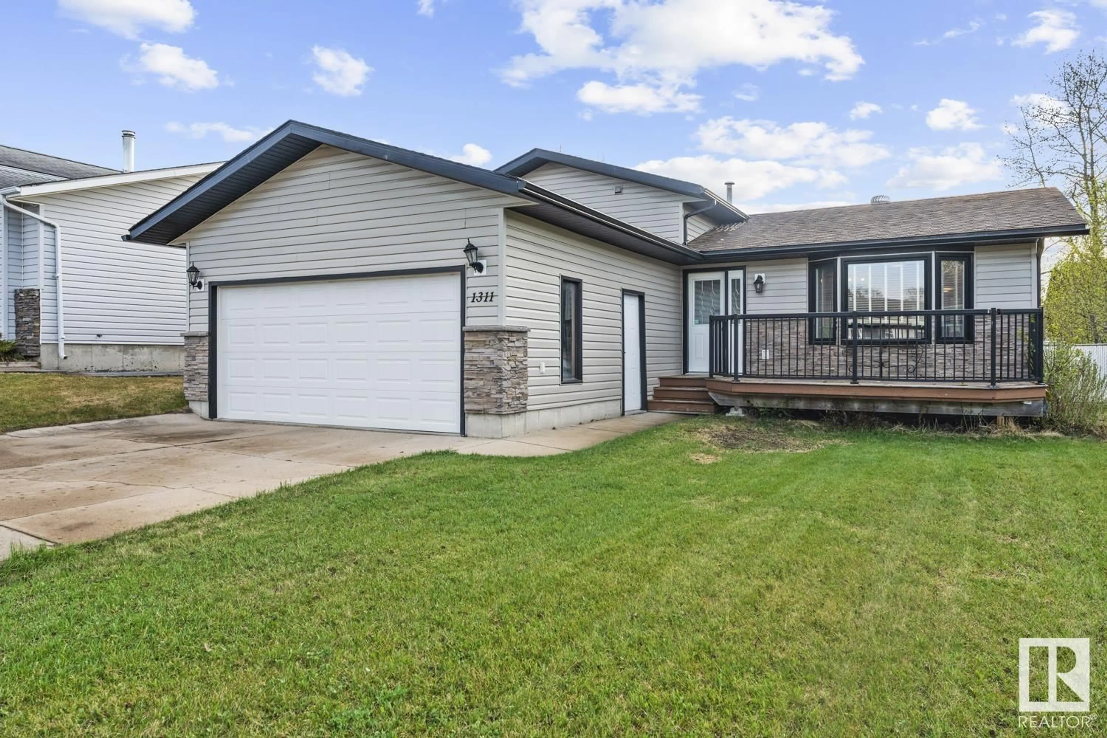 Home with vinyl exterior material, street for 1311 11 ST, Cold Lake Alberta T9M1J5