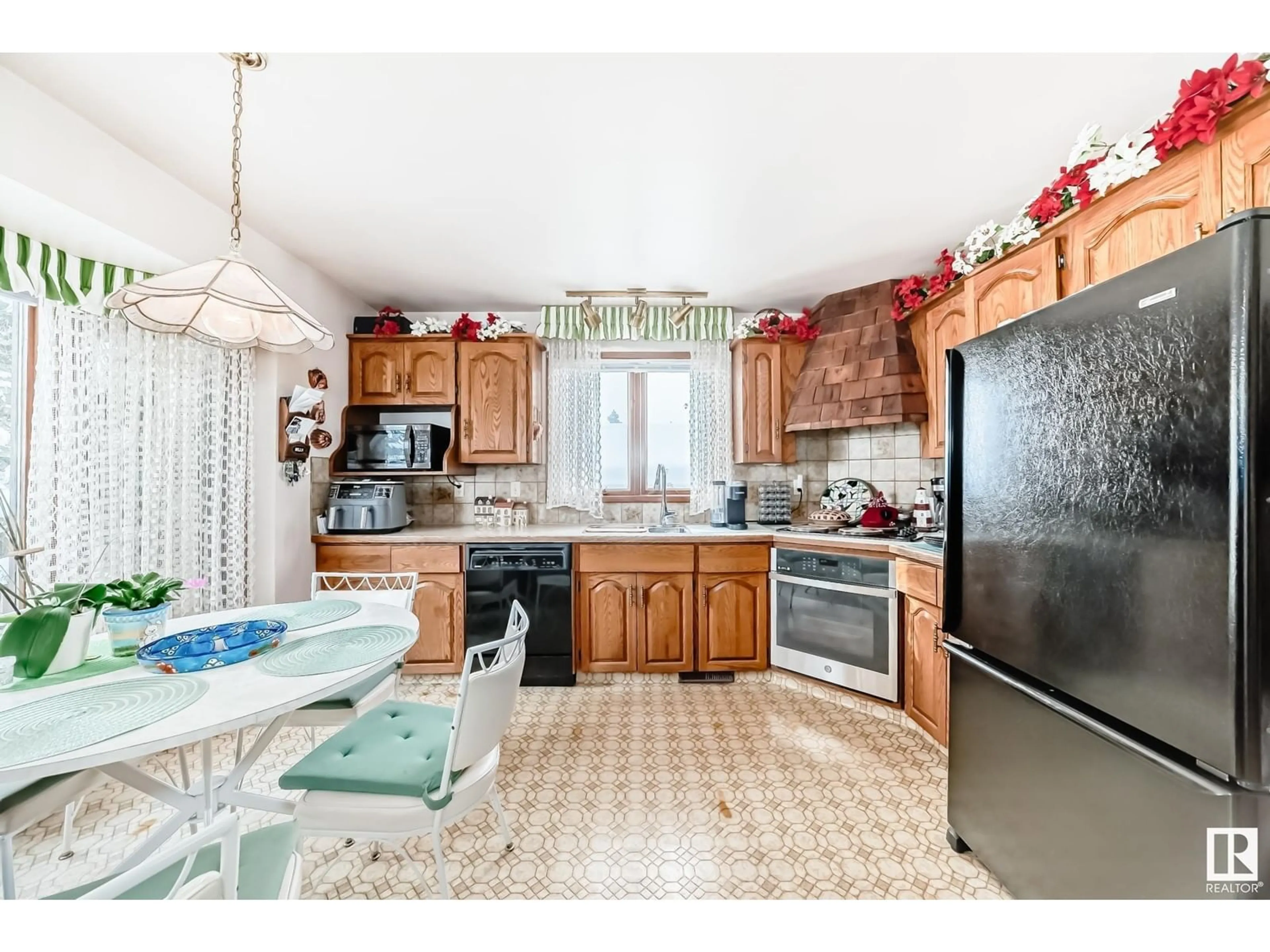 Open concept kitchen, ceramic/tile floor for 4305 74 ST, Camrose Alberta T4V3V3