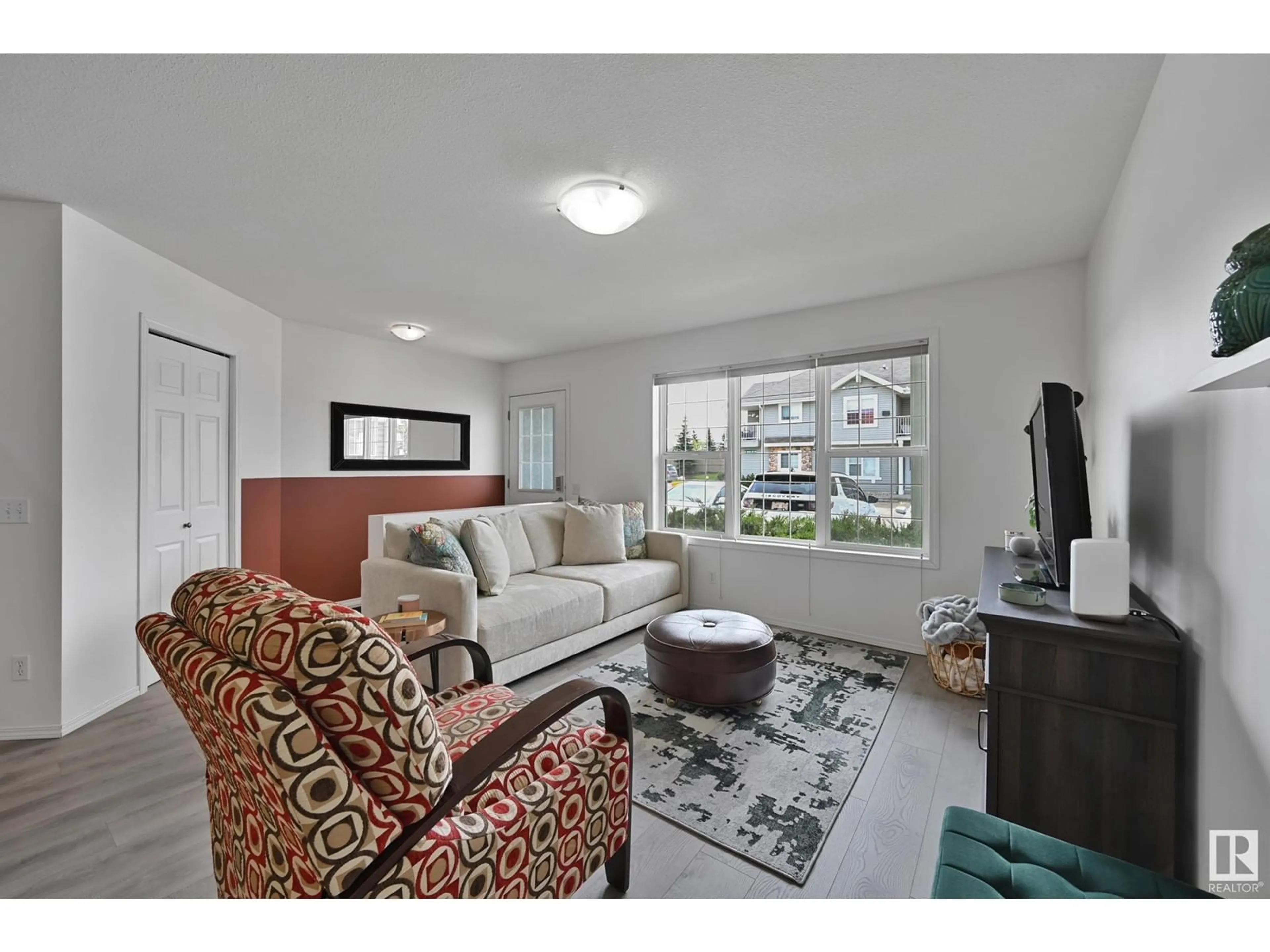 Living room with furniture, unknown for 150 - 76 EDWARDS DR, Edmonton Alberta T6X1M4