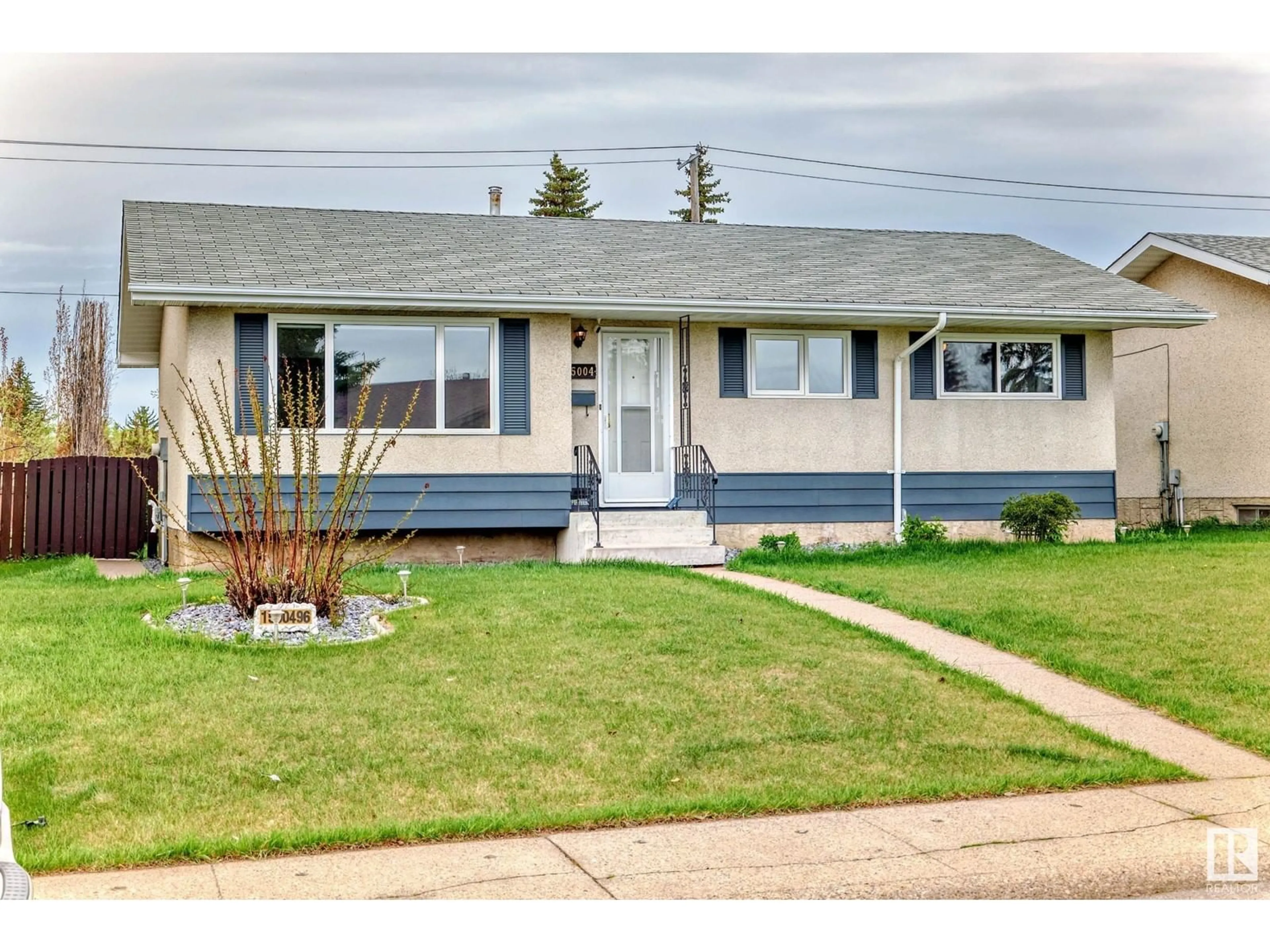 Home with vinyl exterior material, street for 15004 96 ST, Edmonton Alberta T5E4W7
