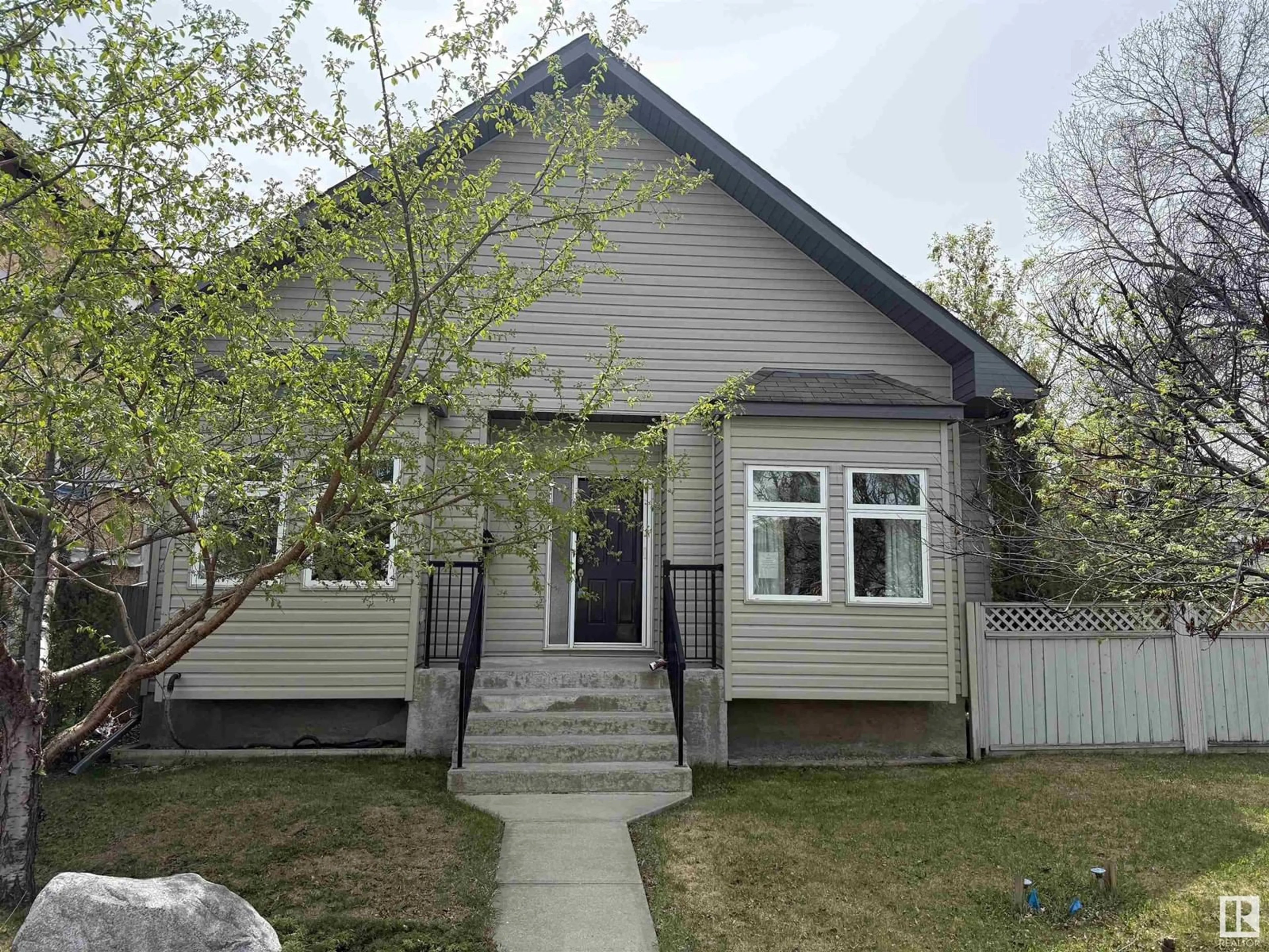 Home with vinyl exterior material, street for 10651 68 AVE AND 6711 107 STREET AV NW, Edmonton Alberta T6H2B3