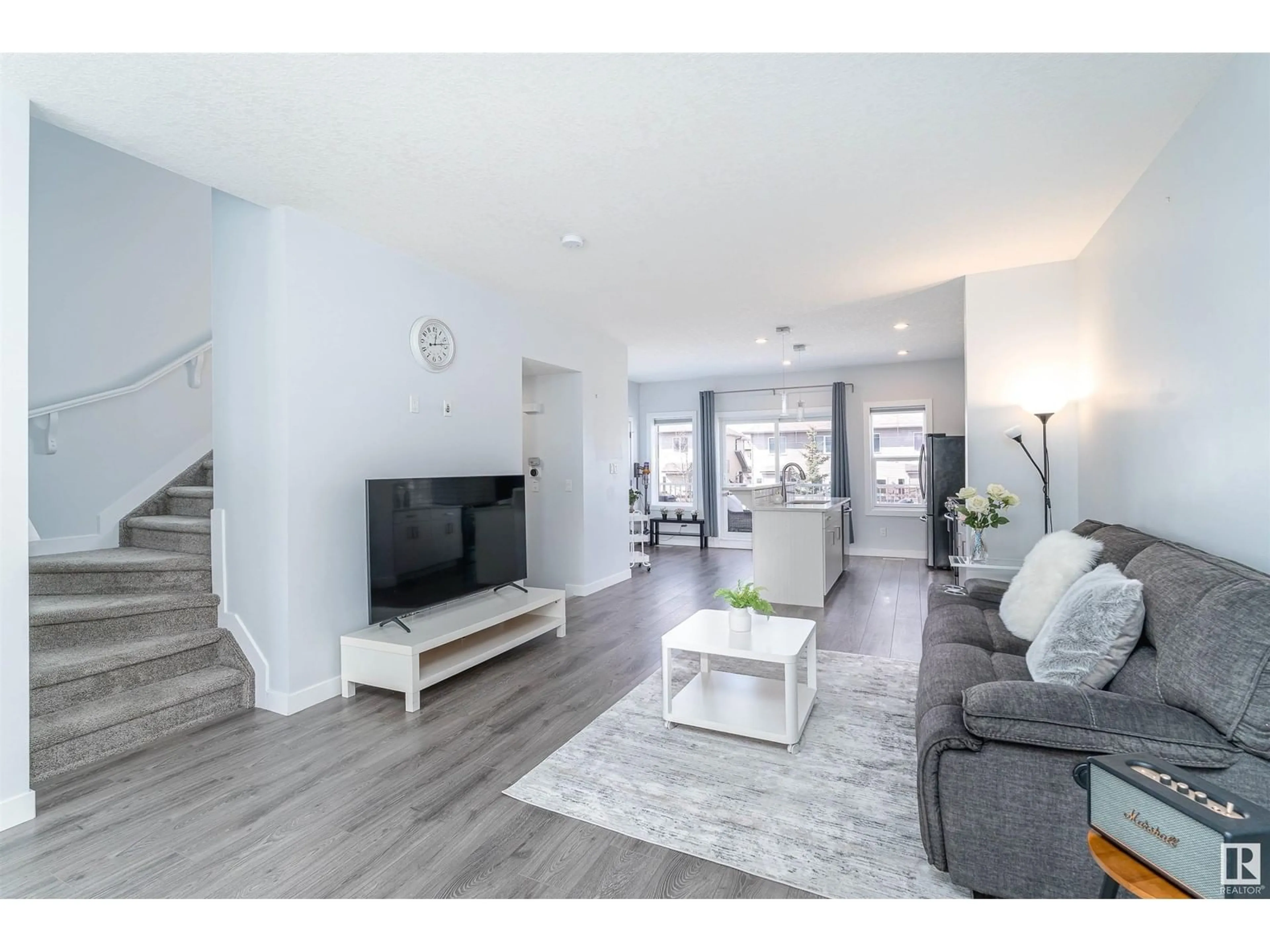 Living room with furniture, wood/laminate floor for 723 - 67 172 ST, Edmonton Alberta T6W2N6
