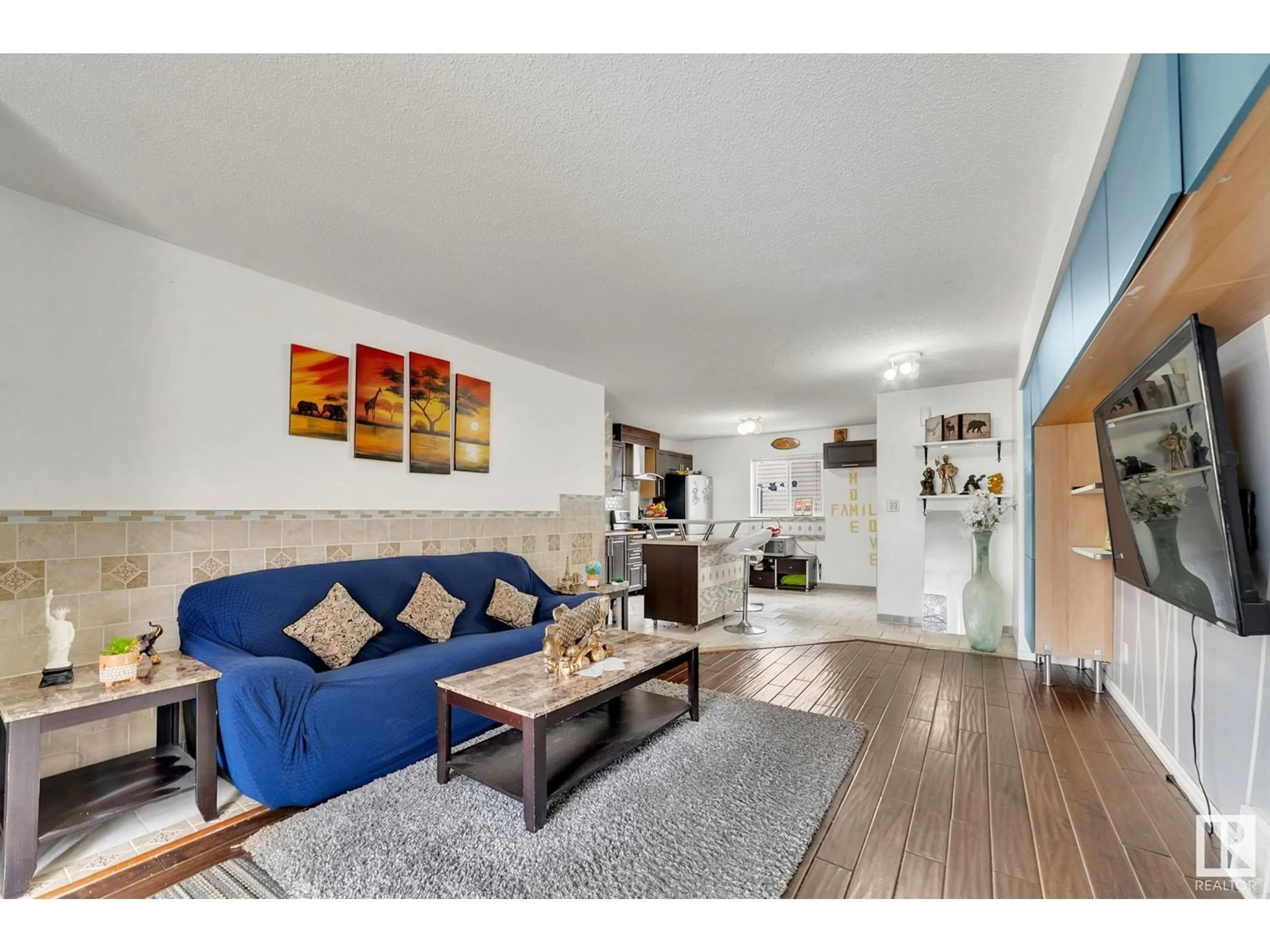 Living room with furniture, wood/laminate floor for 12012 81 ST, Edmonton Alberta T5B2S8
