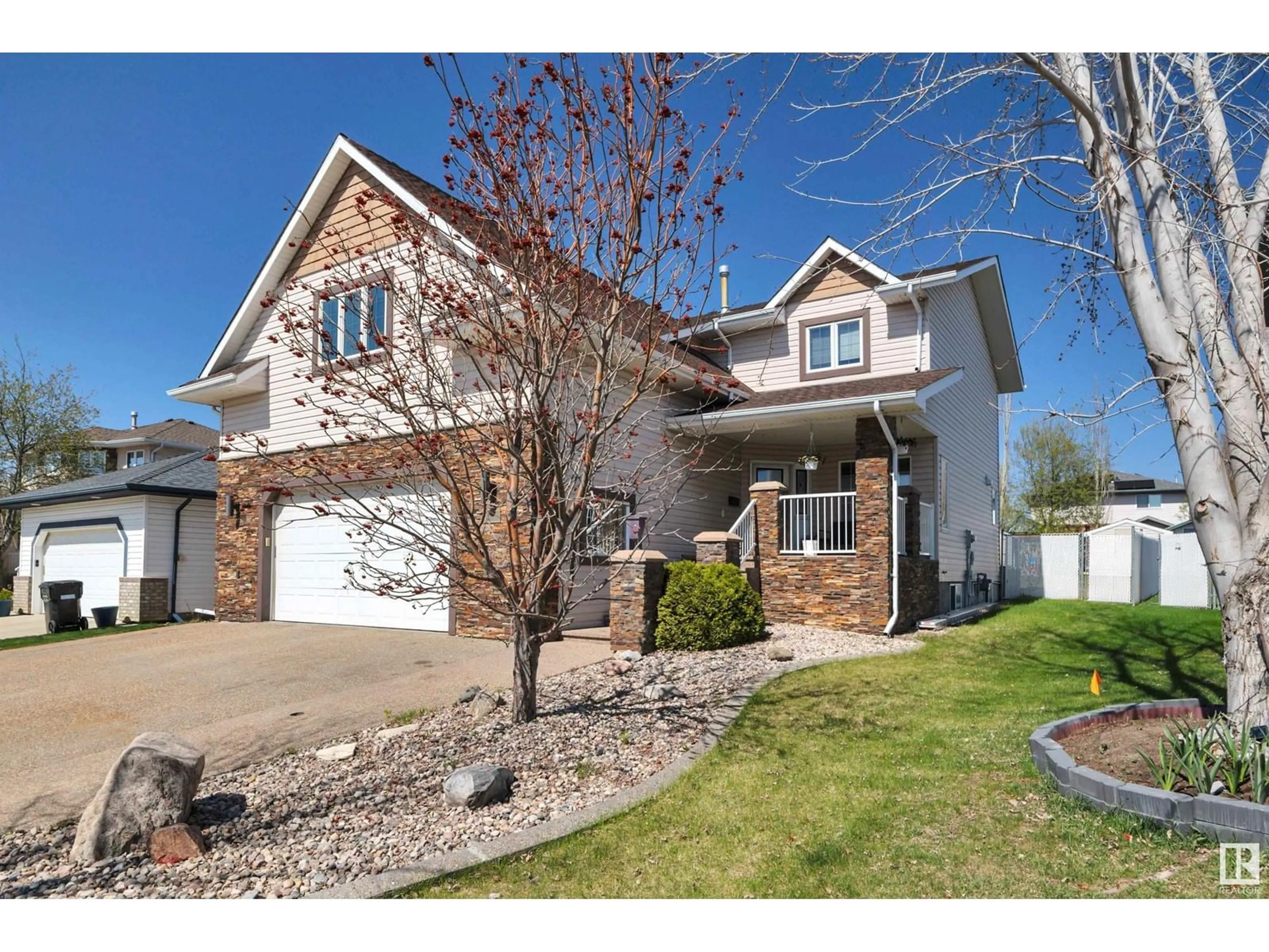 Home with vinyl exterior material, street for 5 BRIDGEPORT, Leduc Alberta T9E8B2