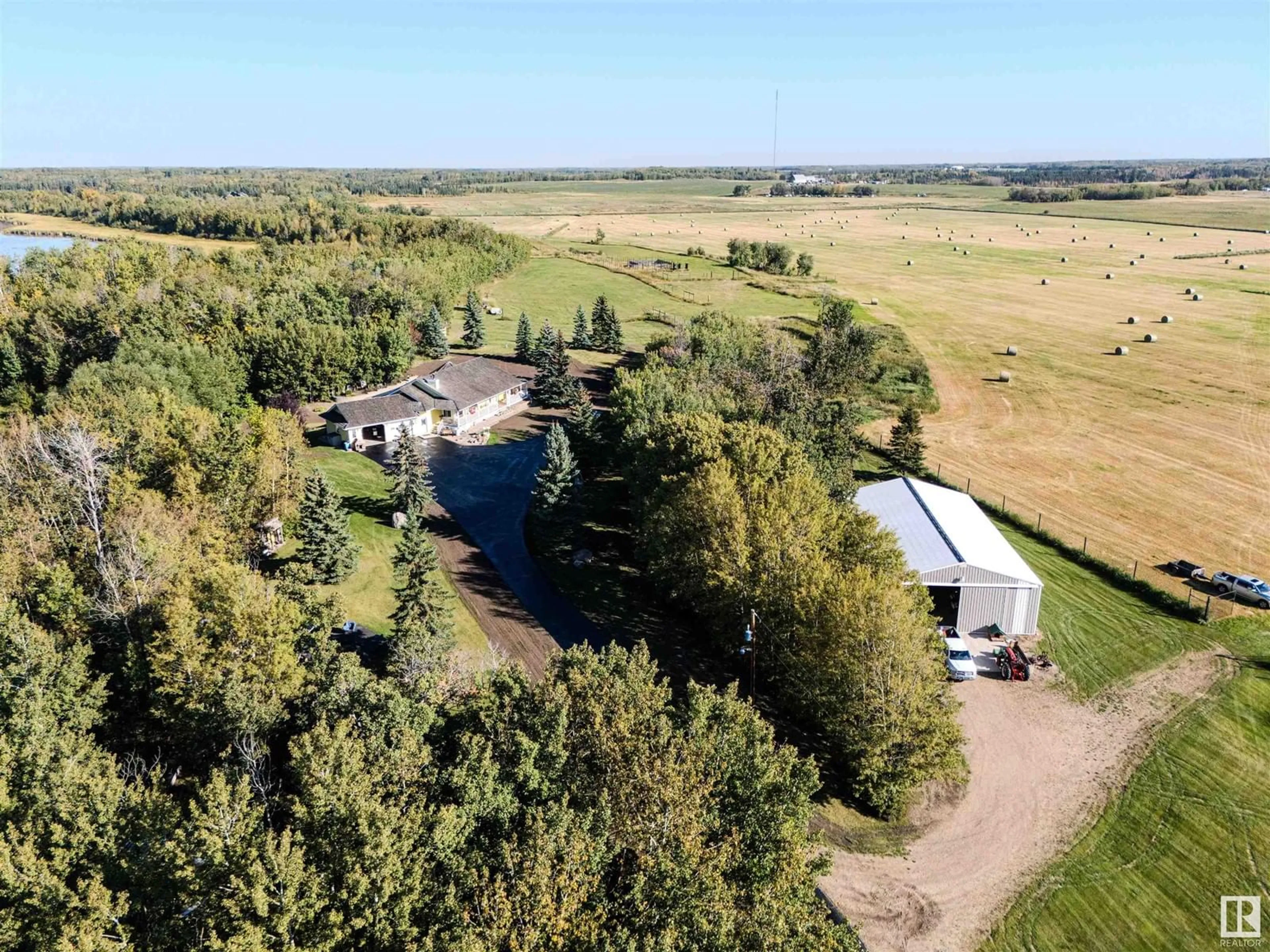 A pic from outside/outdoor area/front of a property/back of a property/a pic from drone, unknown for 23038 TWP ROAD 512, Rural Strathcona County Alberta T8B1K7