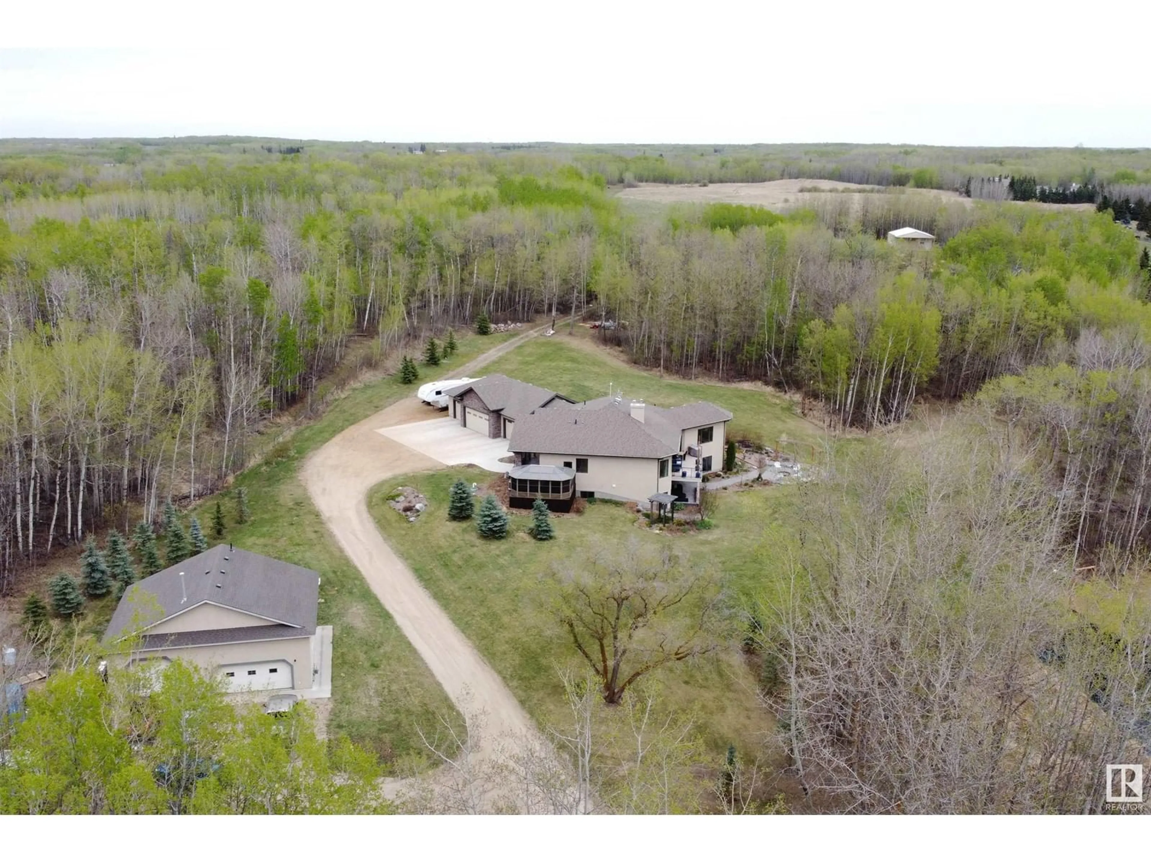 A pic from outside/outdoor area/front of a property/back of a property/a pic from drone, forest/trees view for 52449 RGE ROAD 214, Rural Strathcona County Alberta T8E2G8
