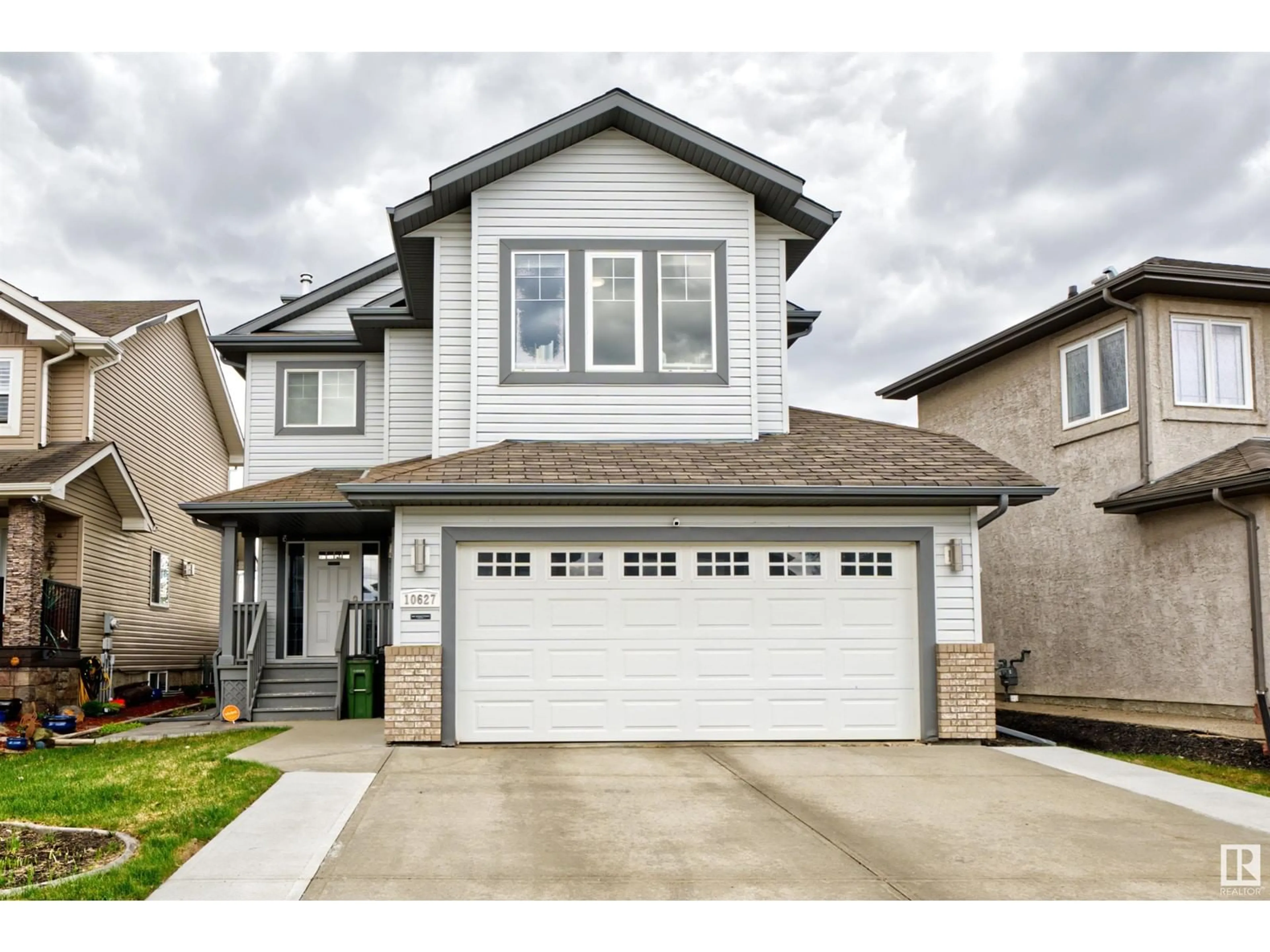 Home with vinyl exterior material, street for NW - 10627 180 AV, Edmonton Alberta T5X6J9