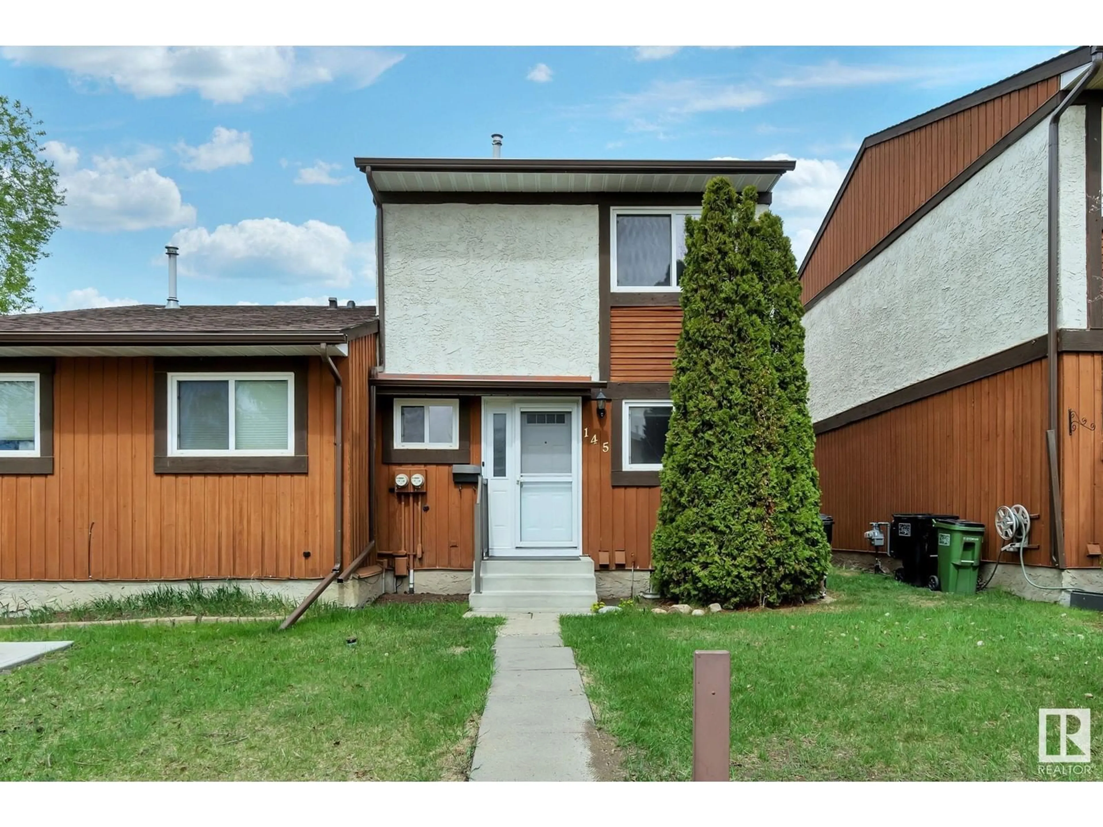 Home with vinyl exterior material, street for #145 - 16725 106 ST, Edmonton Alberta T5X5G5