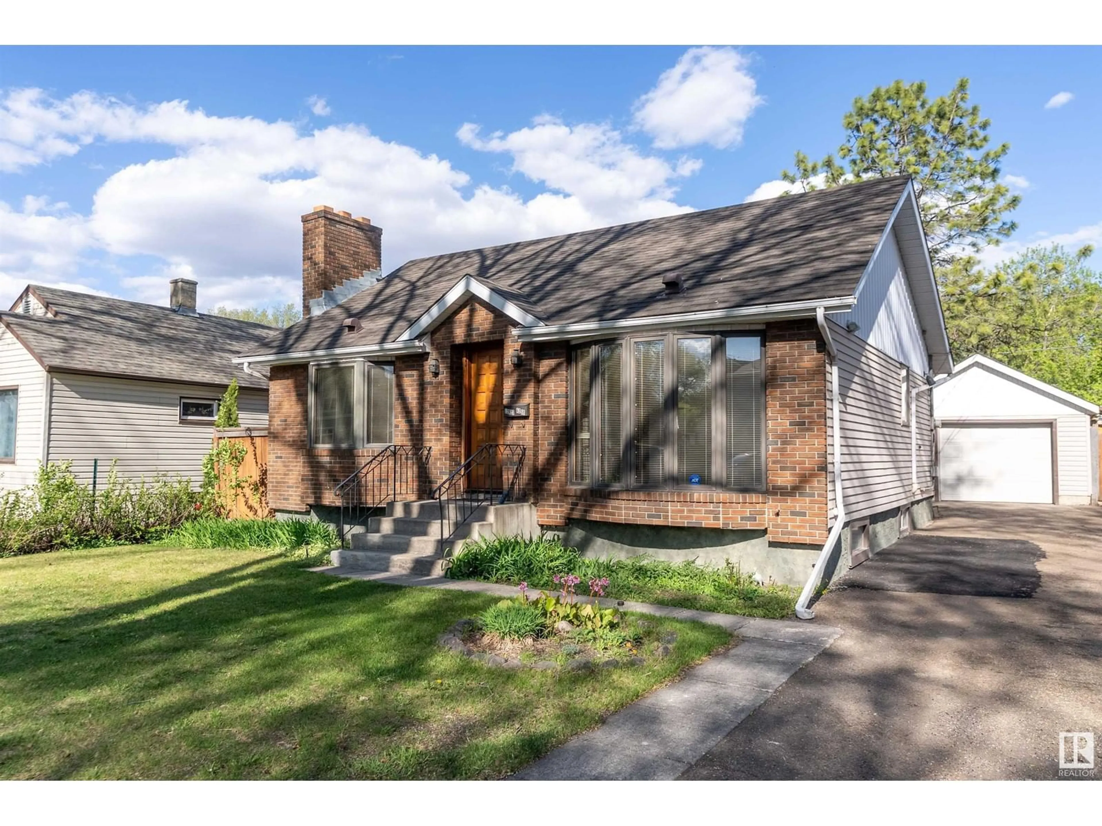 Home with brick exterior material, street for NW - 12027 62 ST, Edmonton Alberta T5W4C9