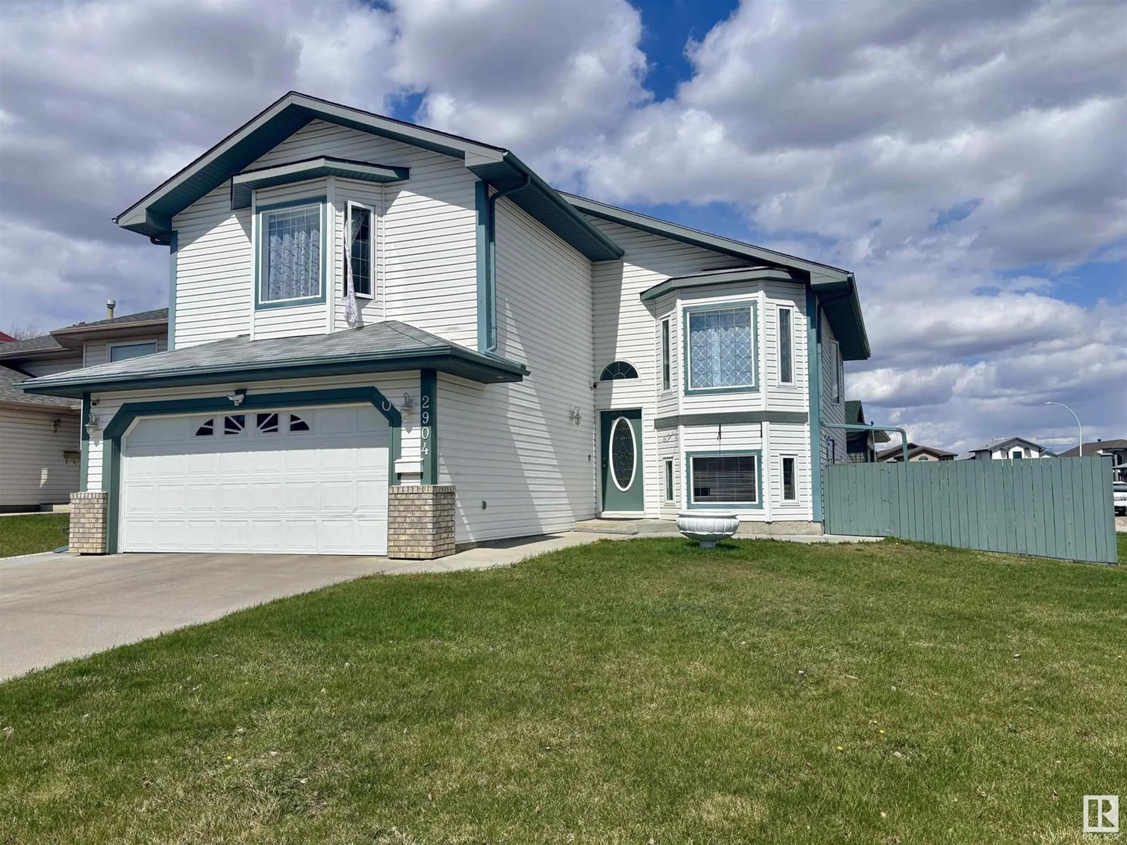 Home with vinyl exterior material, street for NW - 2904 151A AV, Edmonton Alberta T5Y2Y8