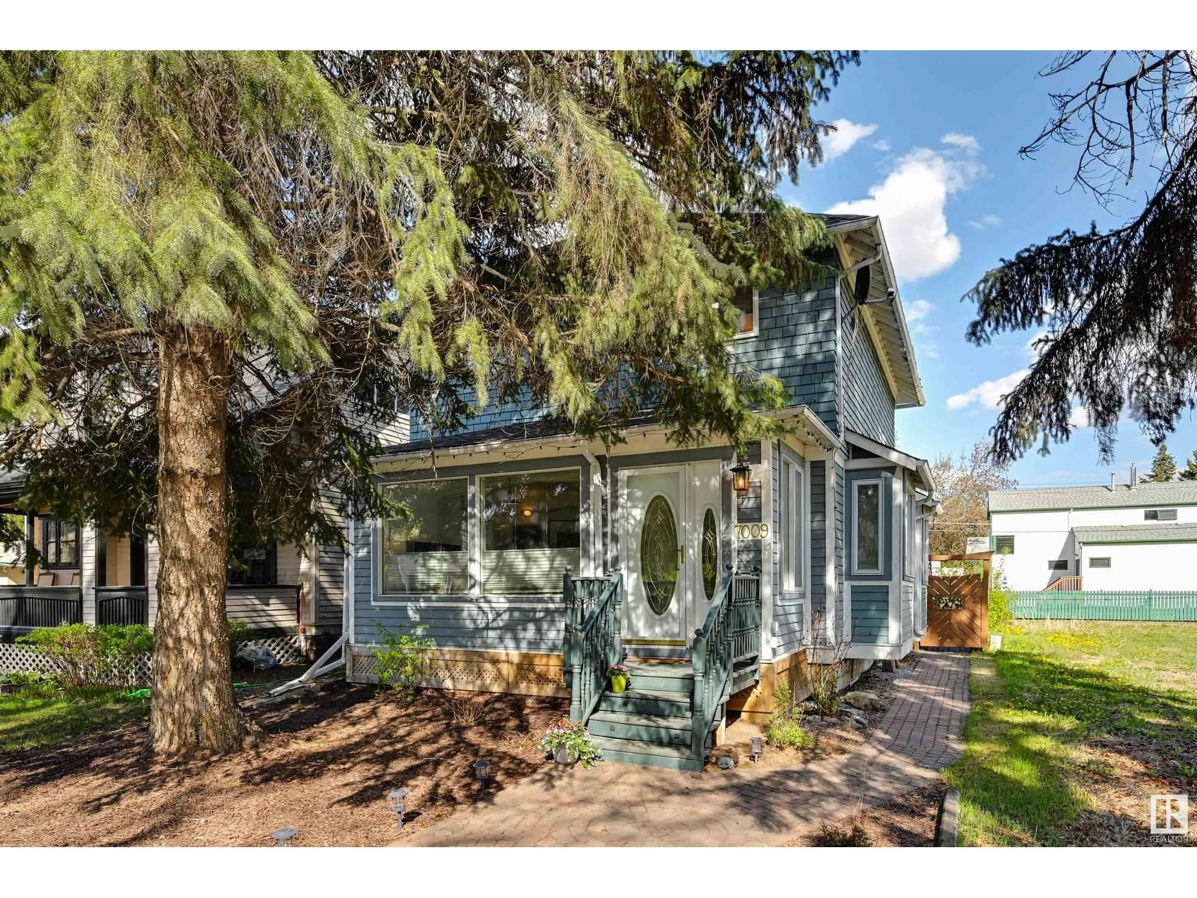 Home with vinyl exterior material, street for 7009 105A ST NW, Edmonton Alberta T6H2R6
