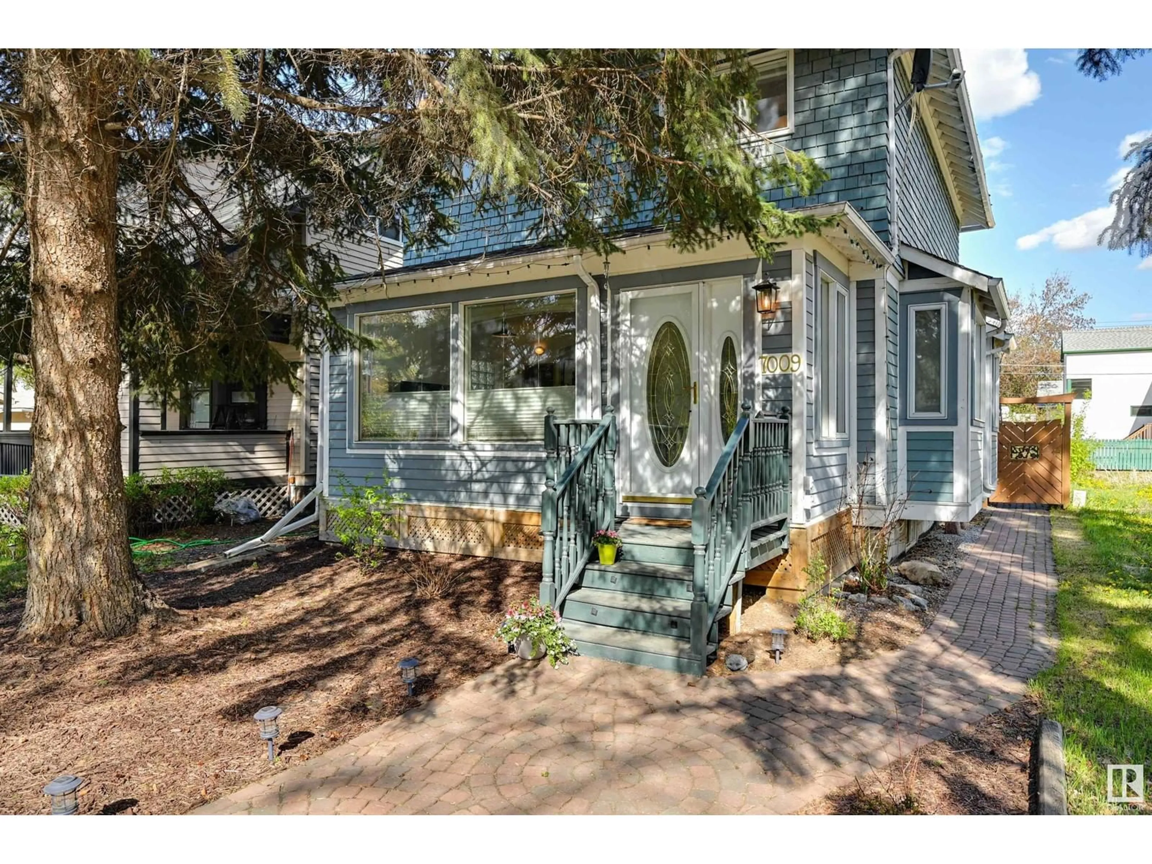 Home with vinyl exterior material, street for 7009 105A ST NW, Edmonton Alberta T6H2R6