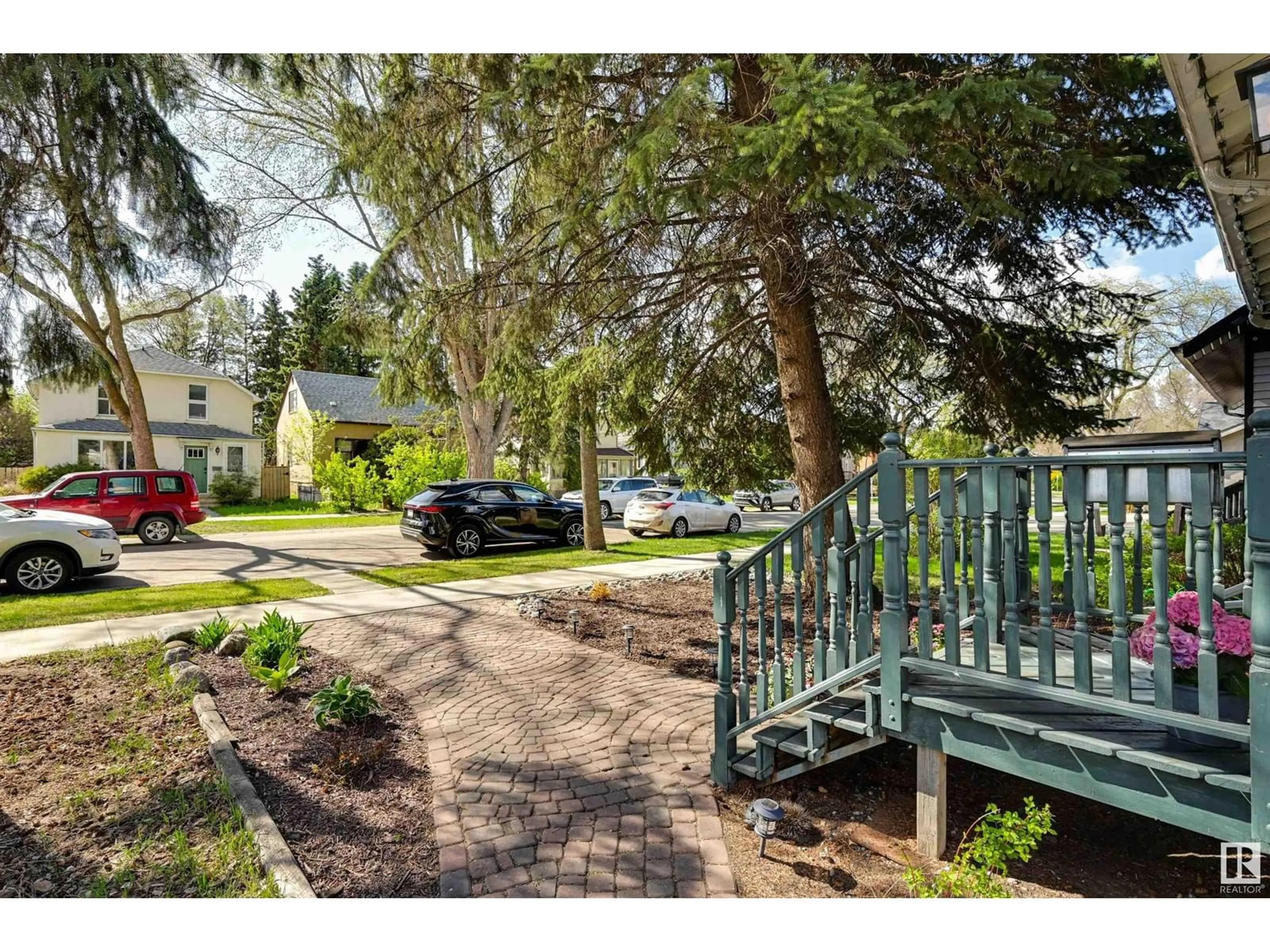 A pic from outside/outdoor area/front of a property/back of a property/a pic from drone, street for 7009 105A ST NW, Edmonton Alberta T6H2R6