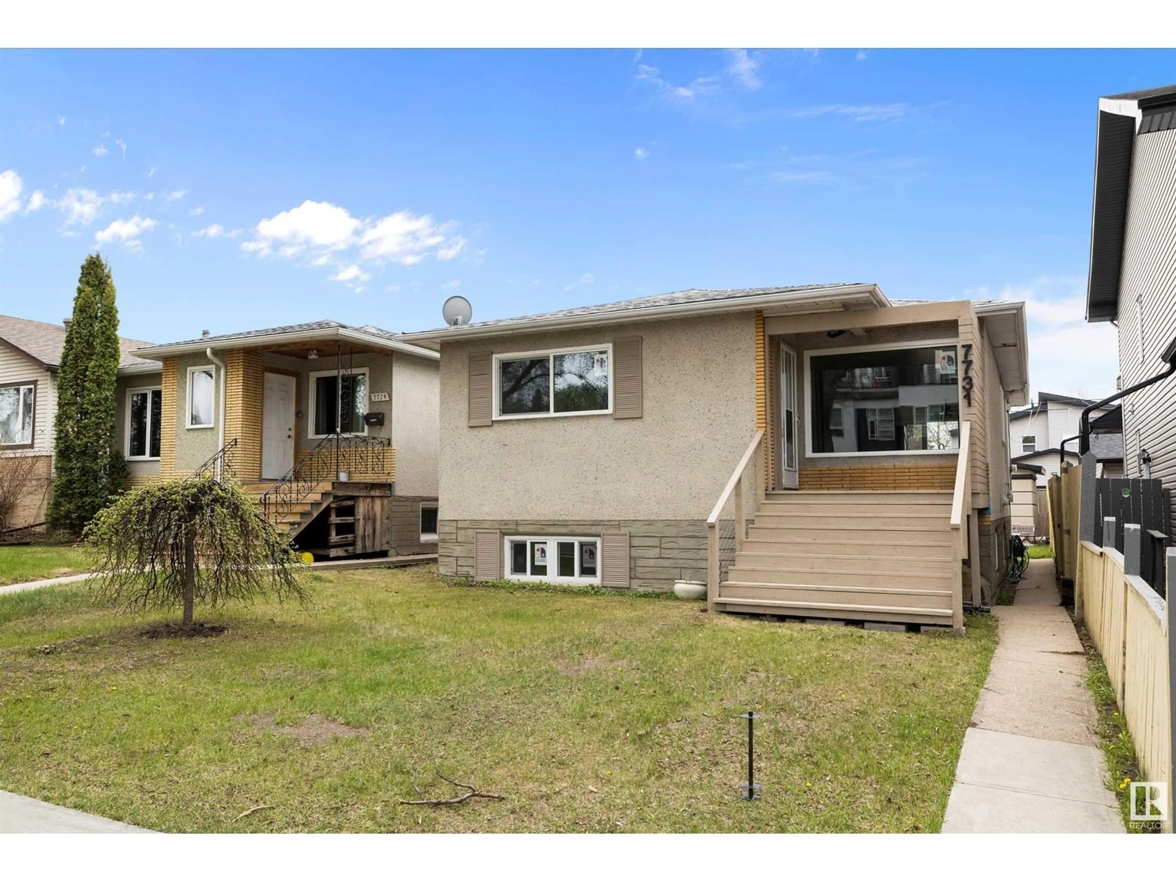 Home with vinyl exterior material, street for 7731 80 AV, Edmonton Alberta T6C0S3