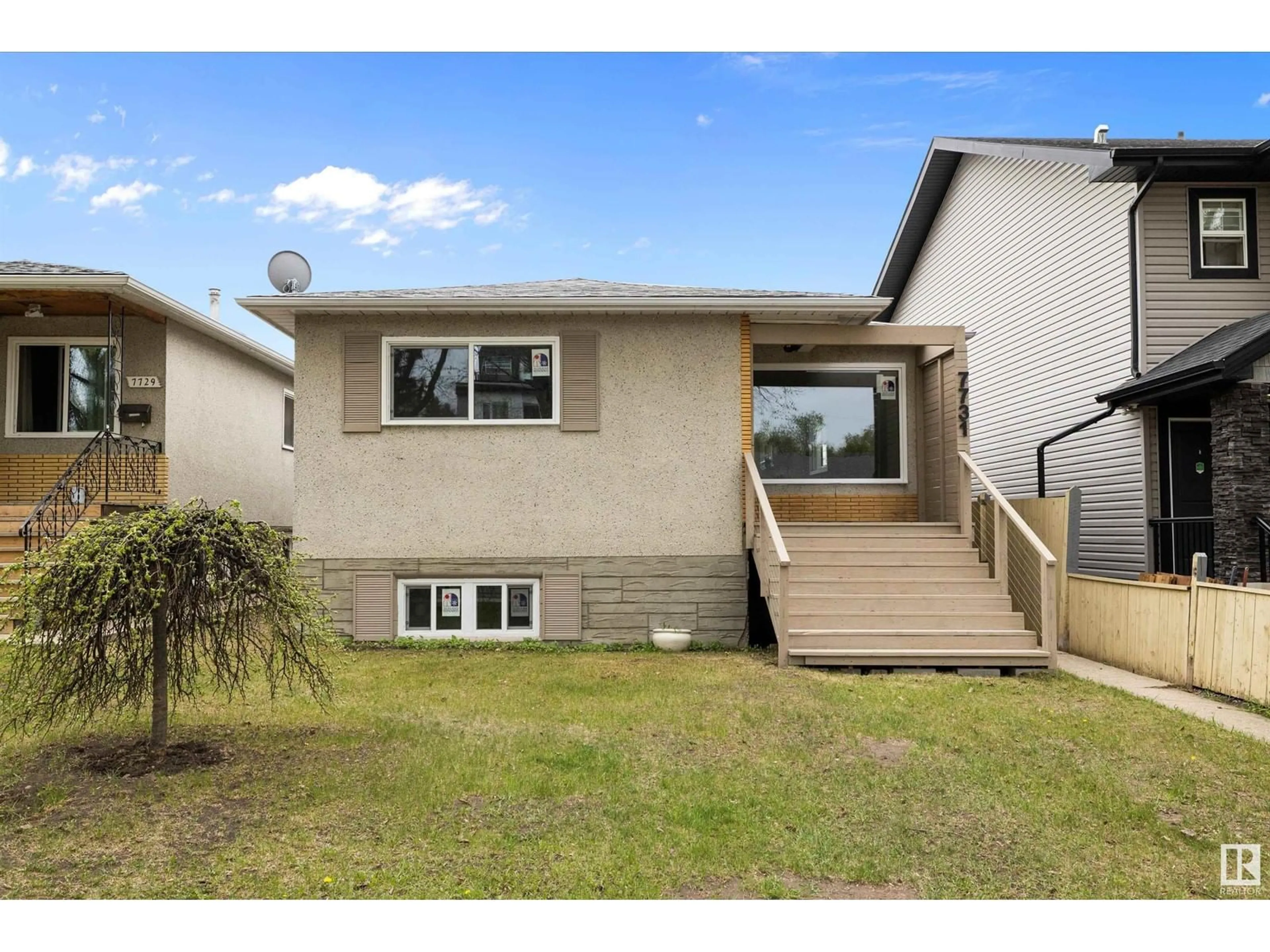 Home with vinyl exterior material, street for 7731 80 AV, Edmonton Alberta T6C0S3