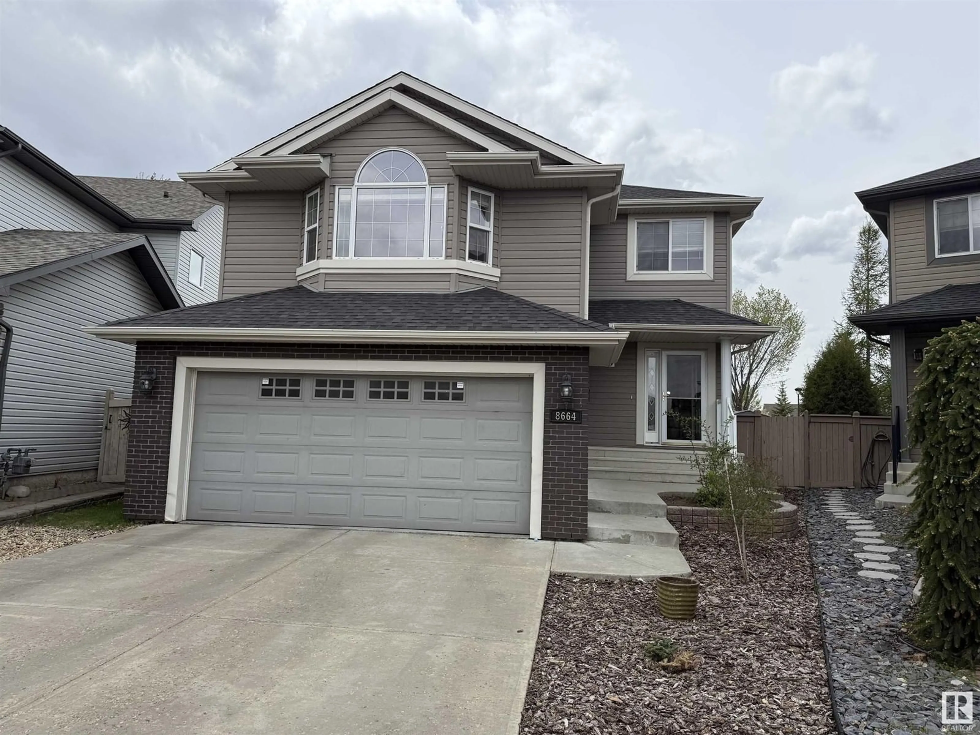 Home with vinyl exterior material, street for 8664 SLOANE CO NW, Edmonton Alberta T6R0K9