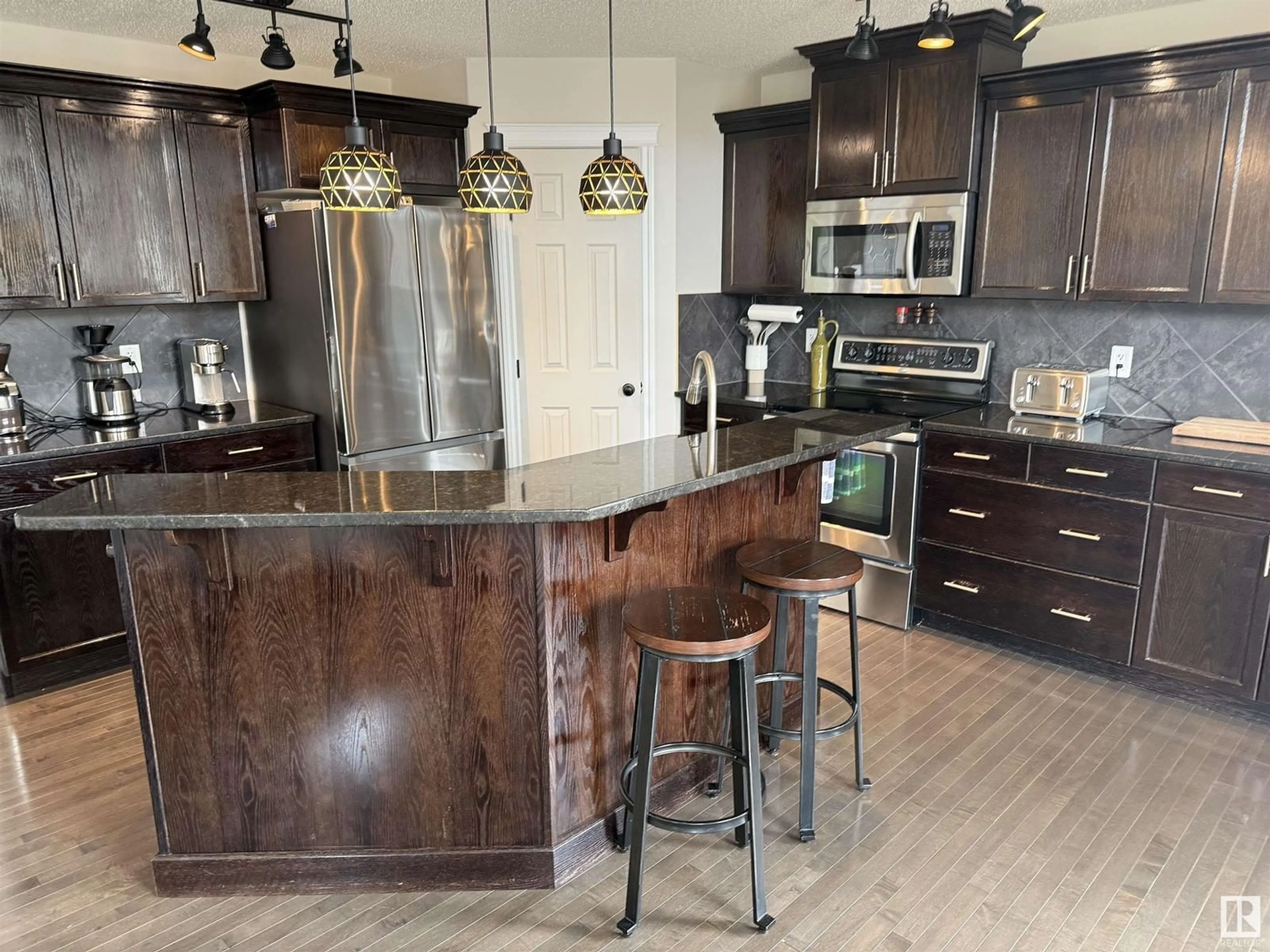 Open concept kitchen, wood/laminate floor for 8664 SLOANE CO NW, Edmonton Alberta T6R0K9