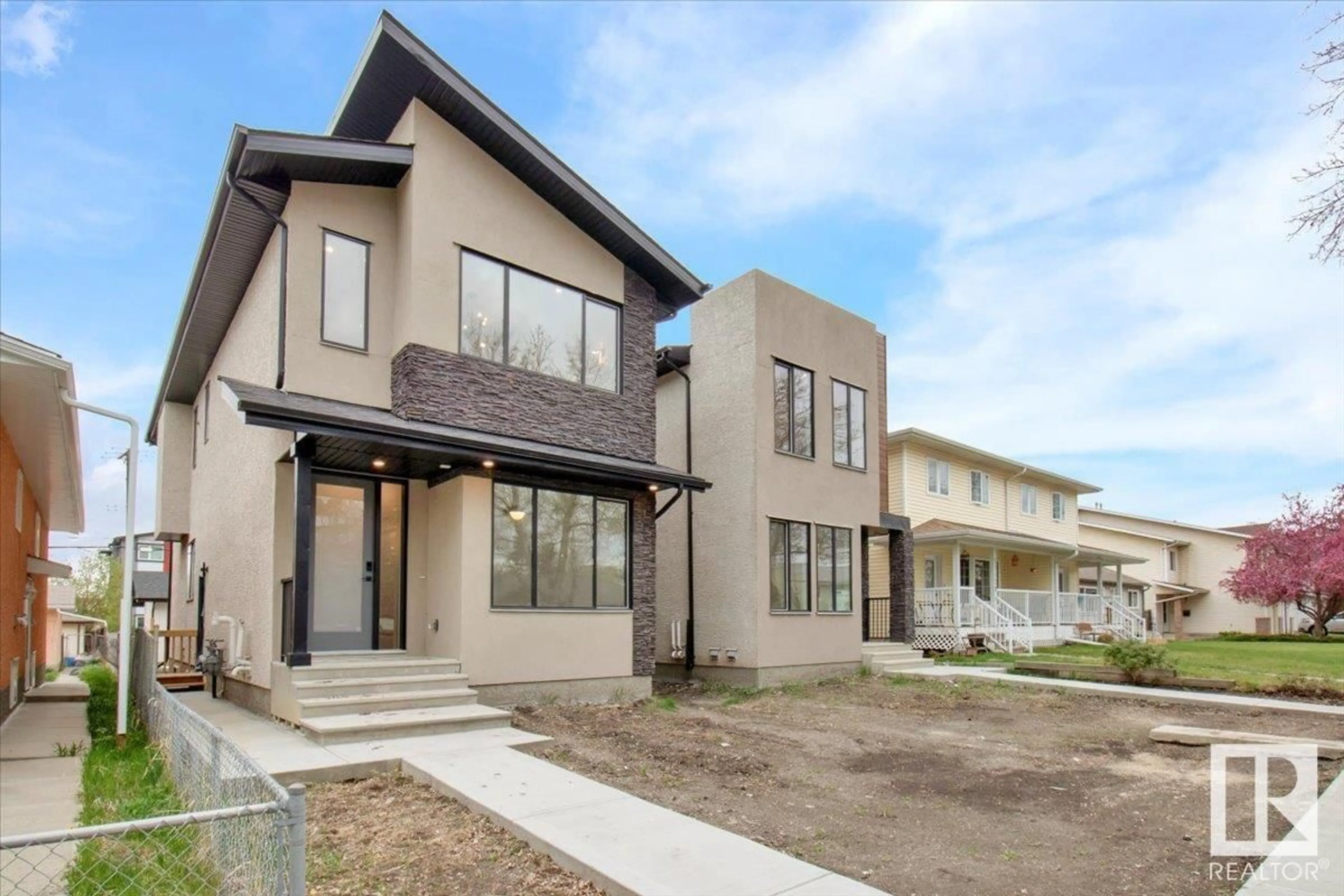 Home with brick exterior material, street for 11124 132 ST, Edmonton Alberta T5M1E5